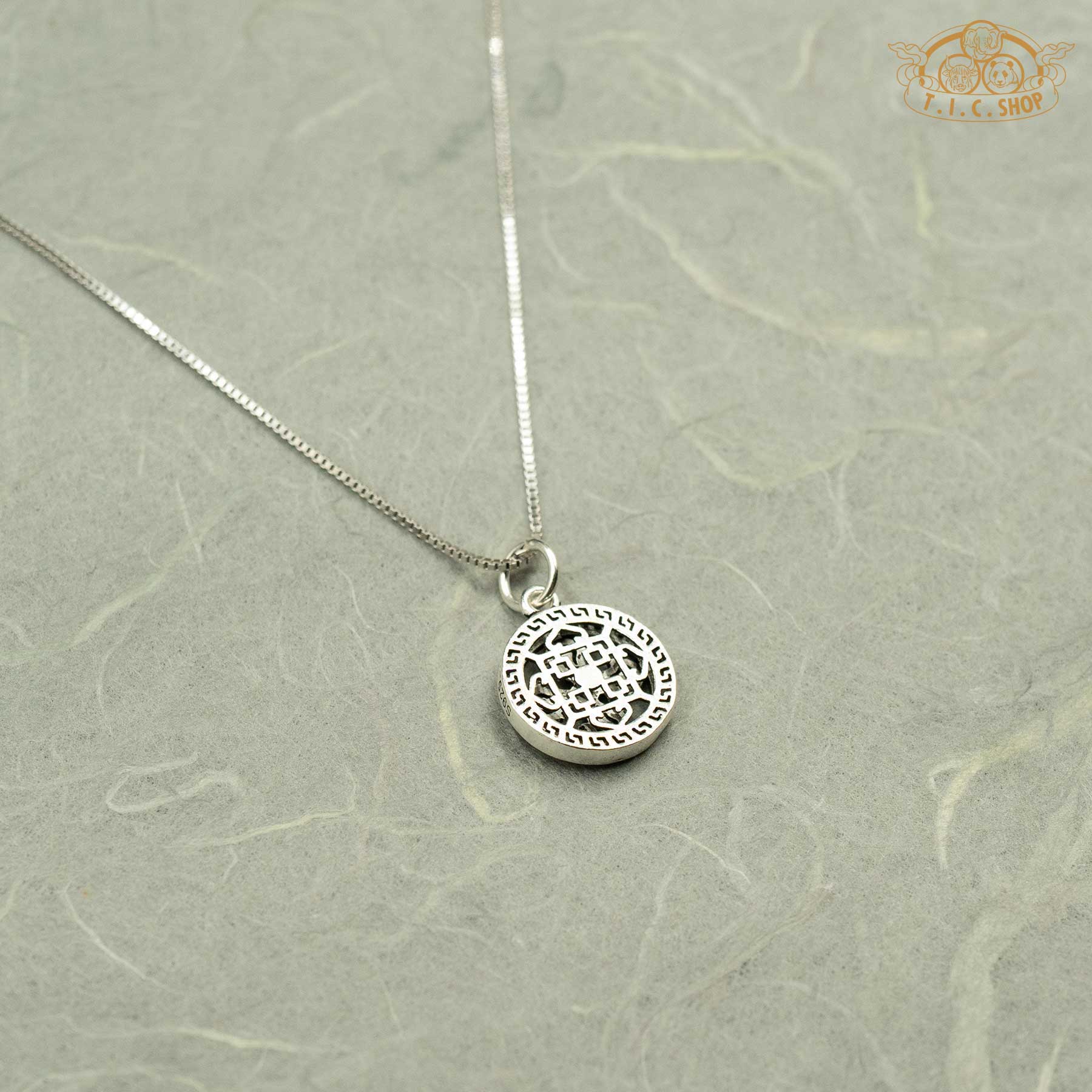 The smooth, hallmark-stamped back of the 925 silver Double Vajra pendant, showing the quality of the craftsmanship.