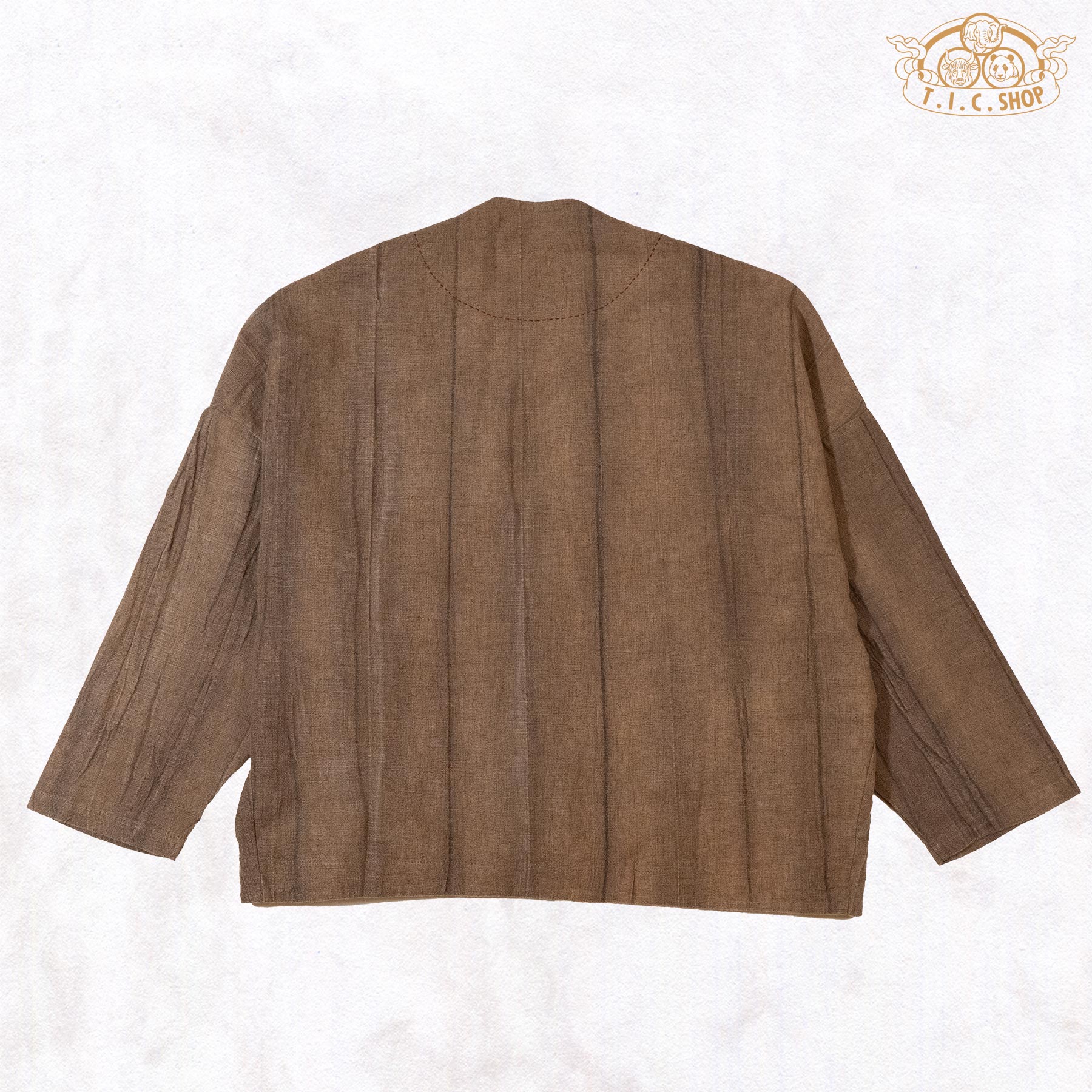 The back of the Zen-style top showing the clean, minimalist drape and natural hand-dyed earthy brown finish.