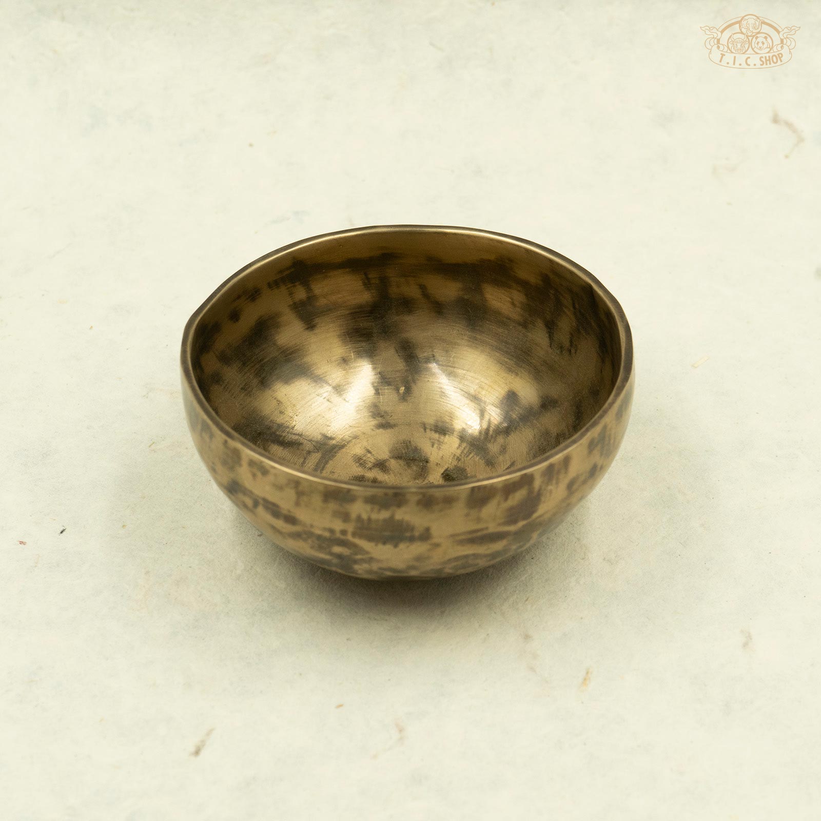 Front view of antique singing bowl made of brass, handcrafted in Nepal, for meditation .