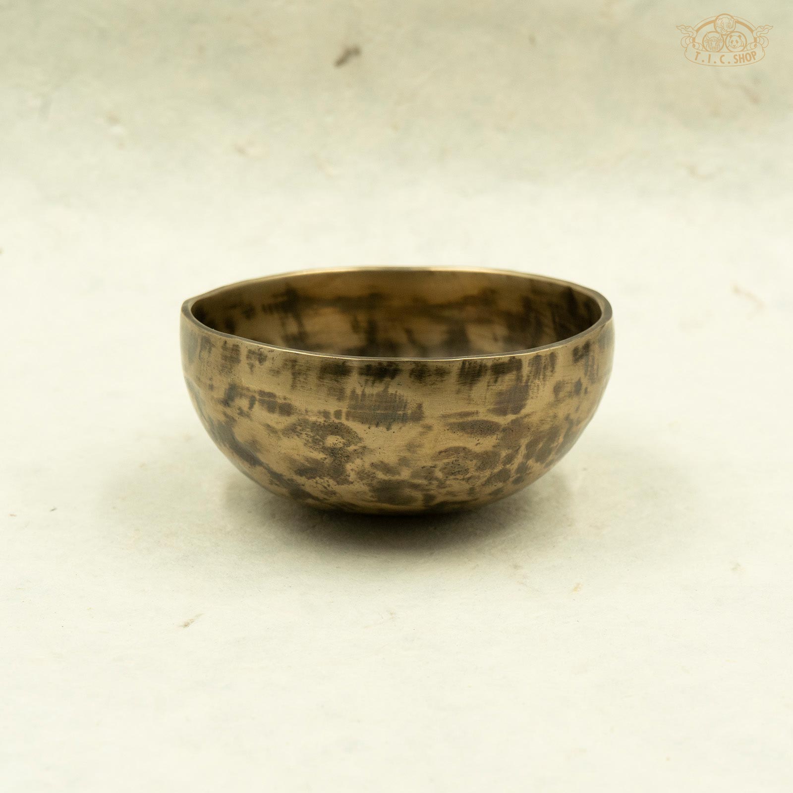 Side view of antique singing bowl made of brass, handcrafted in Nepal, for meditation .