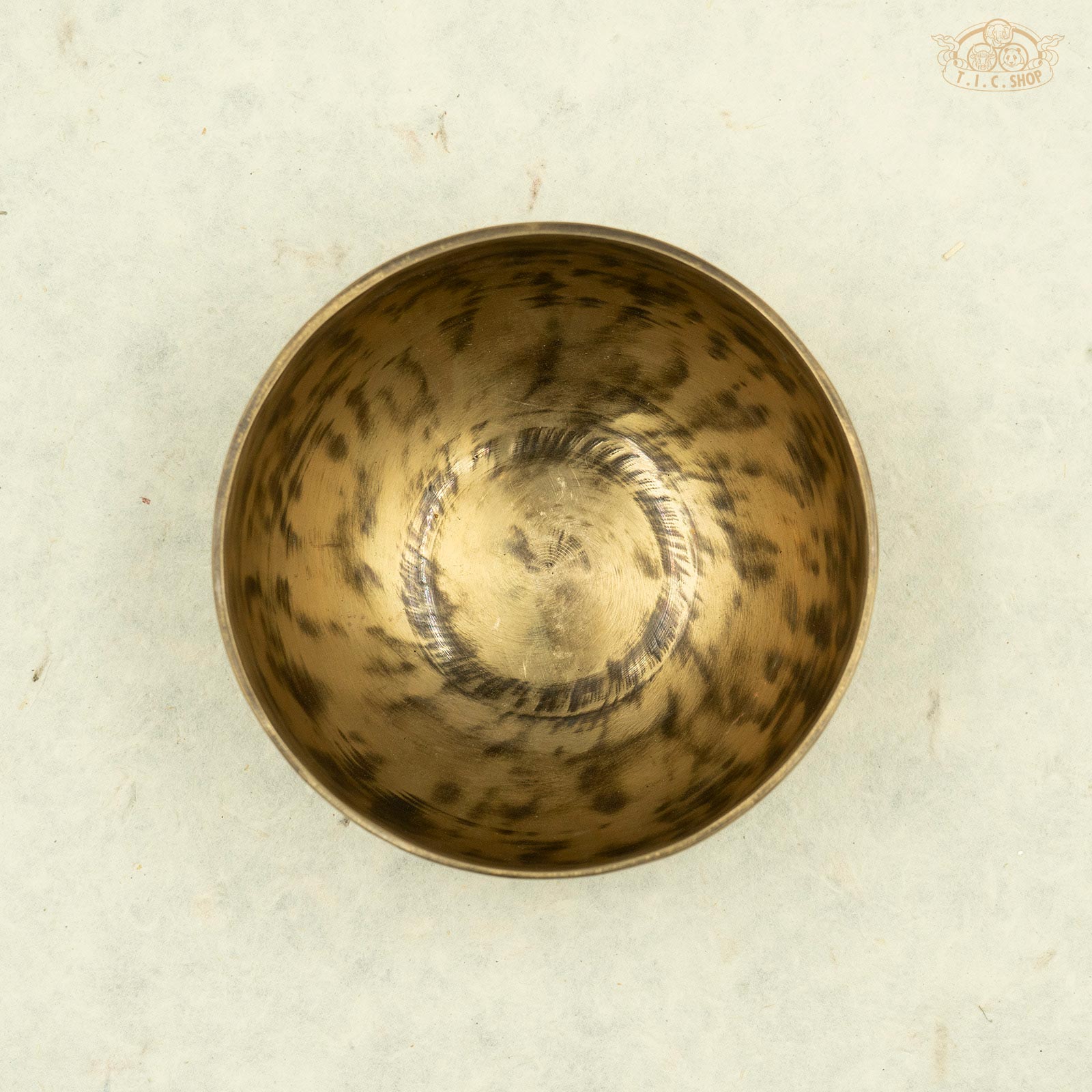 Top view of Tibetan antique singing bowl made of brass, handcrafted in Nepal, for meditation and spiritual practice.