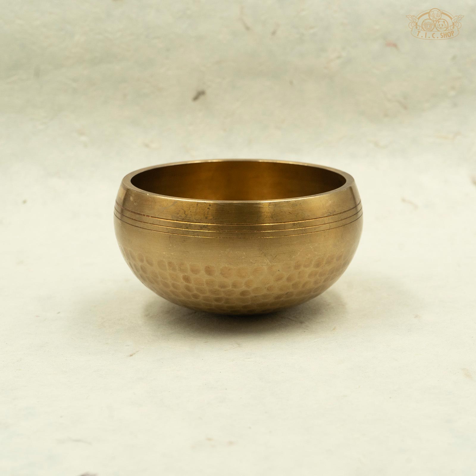 Side of Tibetan handcrafted brass singing bowl handmade by Nepal artisans,full of positive energy for meditation and spiritual practice.