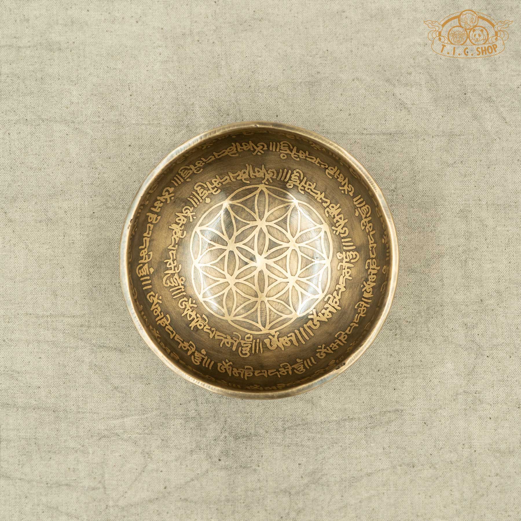Top view of brass Tibetan Singing bowl with engraved OM MANI PADME HUM design on by Nepal artisans