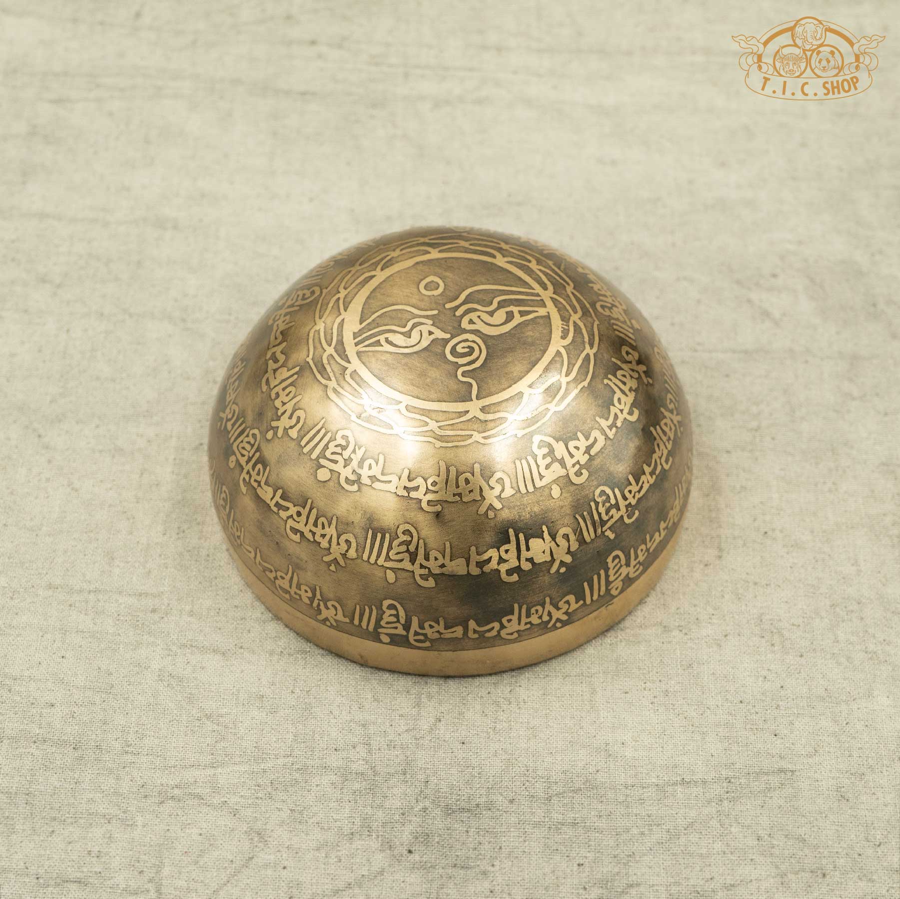 Back view of brass Tibetan Singing bowl with engraved OM MANI PADME HUM design on by Nepal artisans for meditation