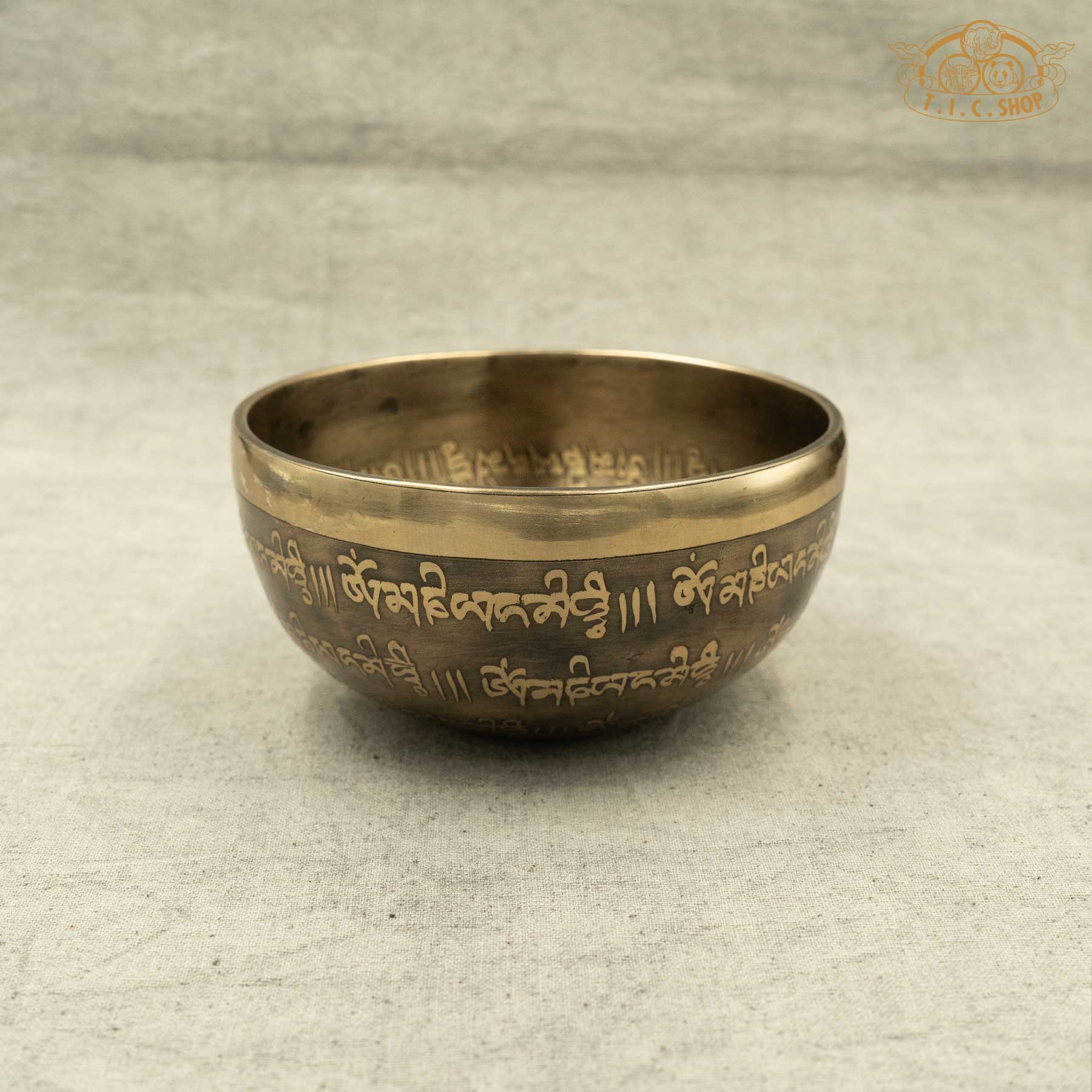 Side view view of Endless Knot Tibetan singing bowl with engraved endless knot pattern,OM MANI PADME HUM Mantras, handmade in Nepal for meditation and spiritual practice
