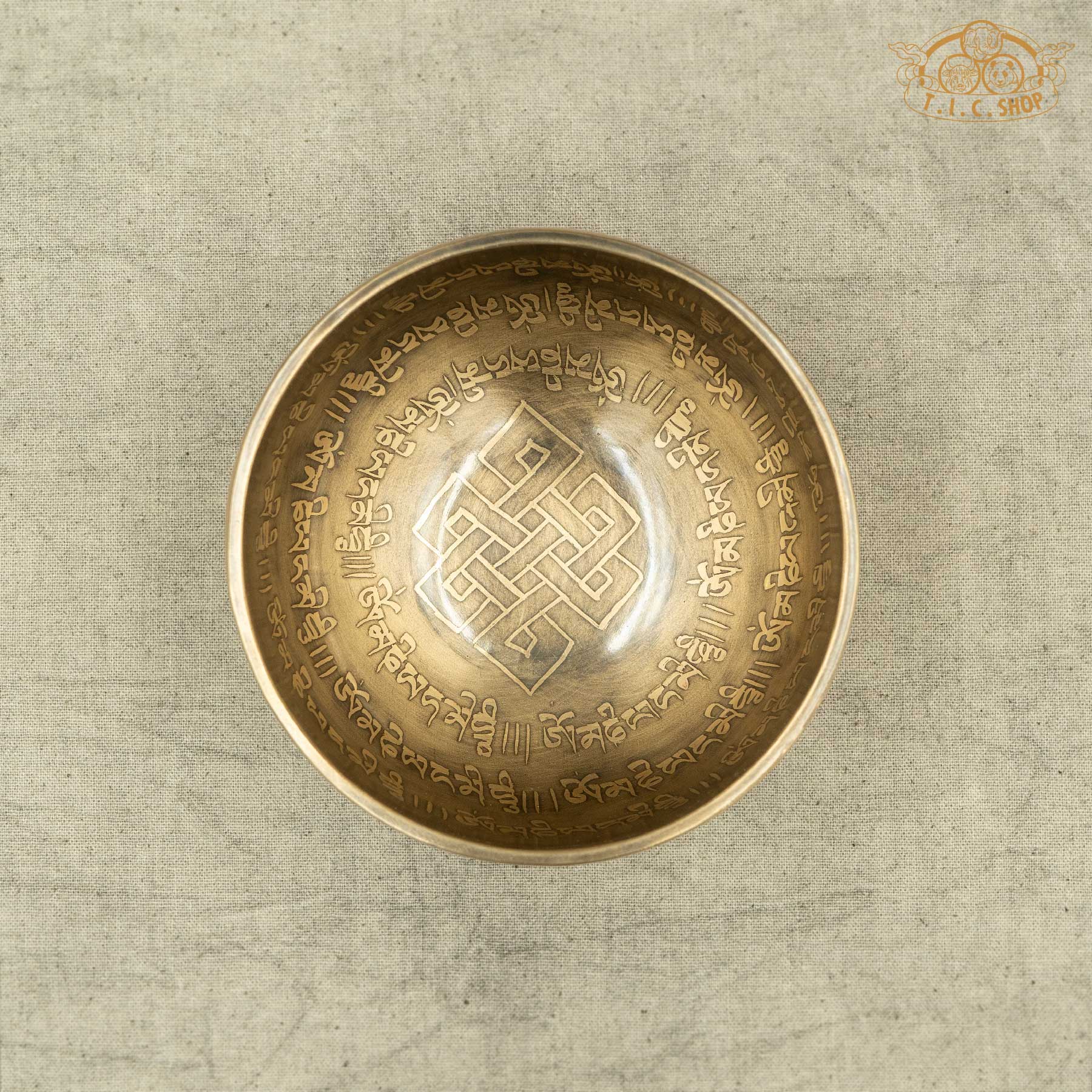 Top view of Endless Knot Tibetan singing bowl showing detailed engraved endless knot motif, handcrafted in Nepal for altar and mindfulness