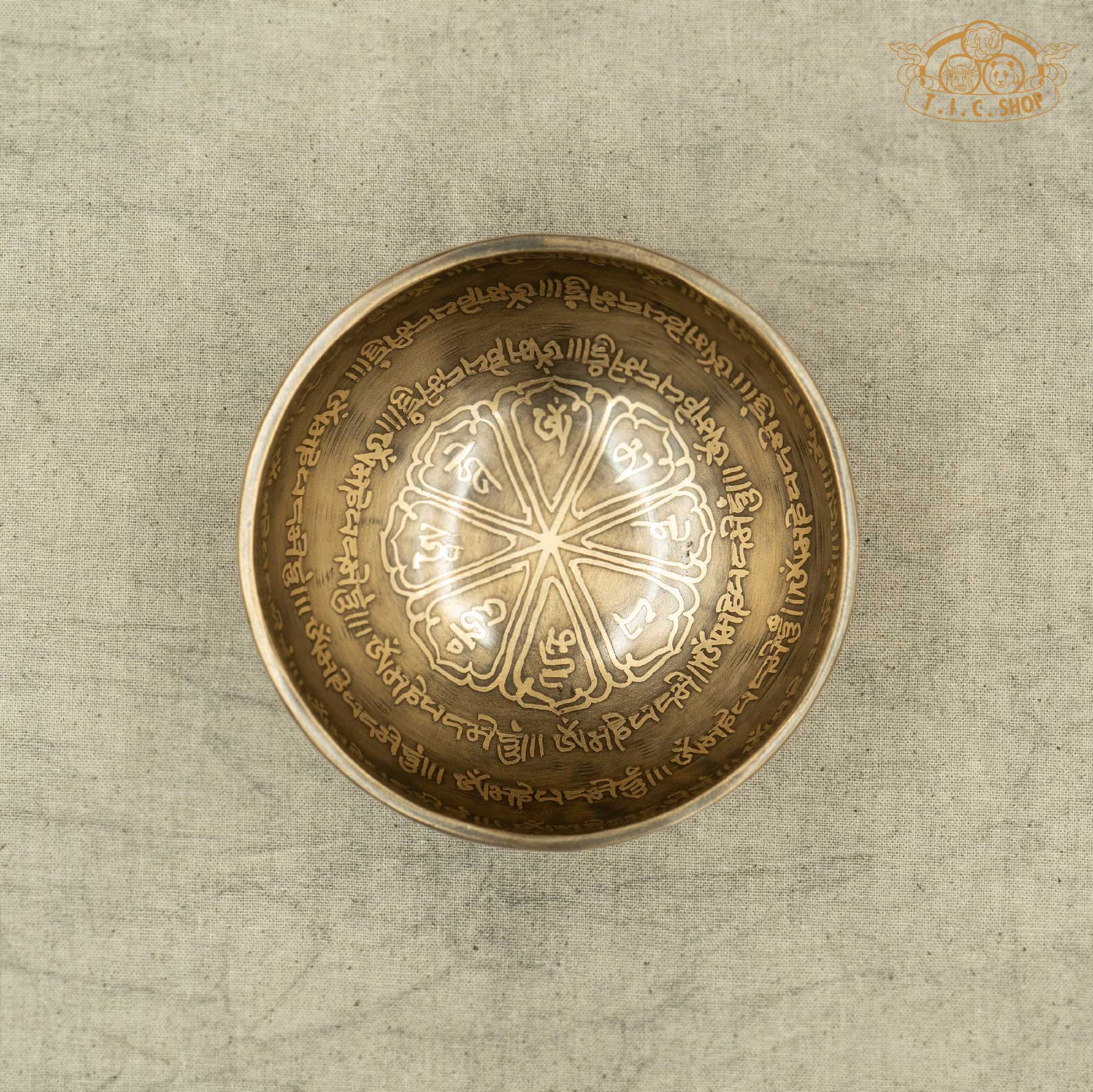 Top view of Tibetan Singing Bowl with lotus symbol and OM MANI PADME HUM Mantras, handmade in Nepal for meditation and spirtual practice