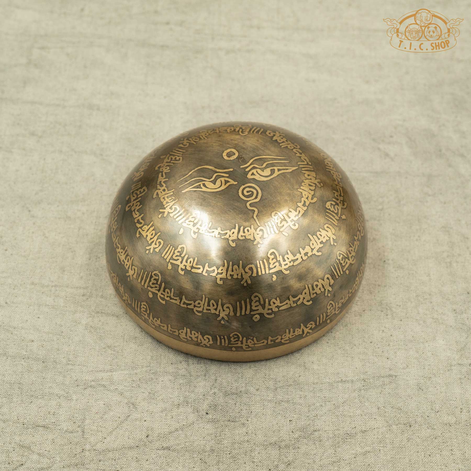 Back view of Tibetan Singing Bowl with Buddha Eyes Symbol and OM MANI PADME HUM Mantras, handmade in Nepal for meditation and spiritual