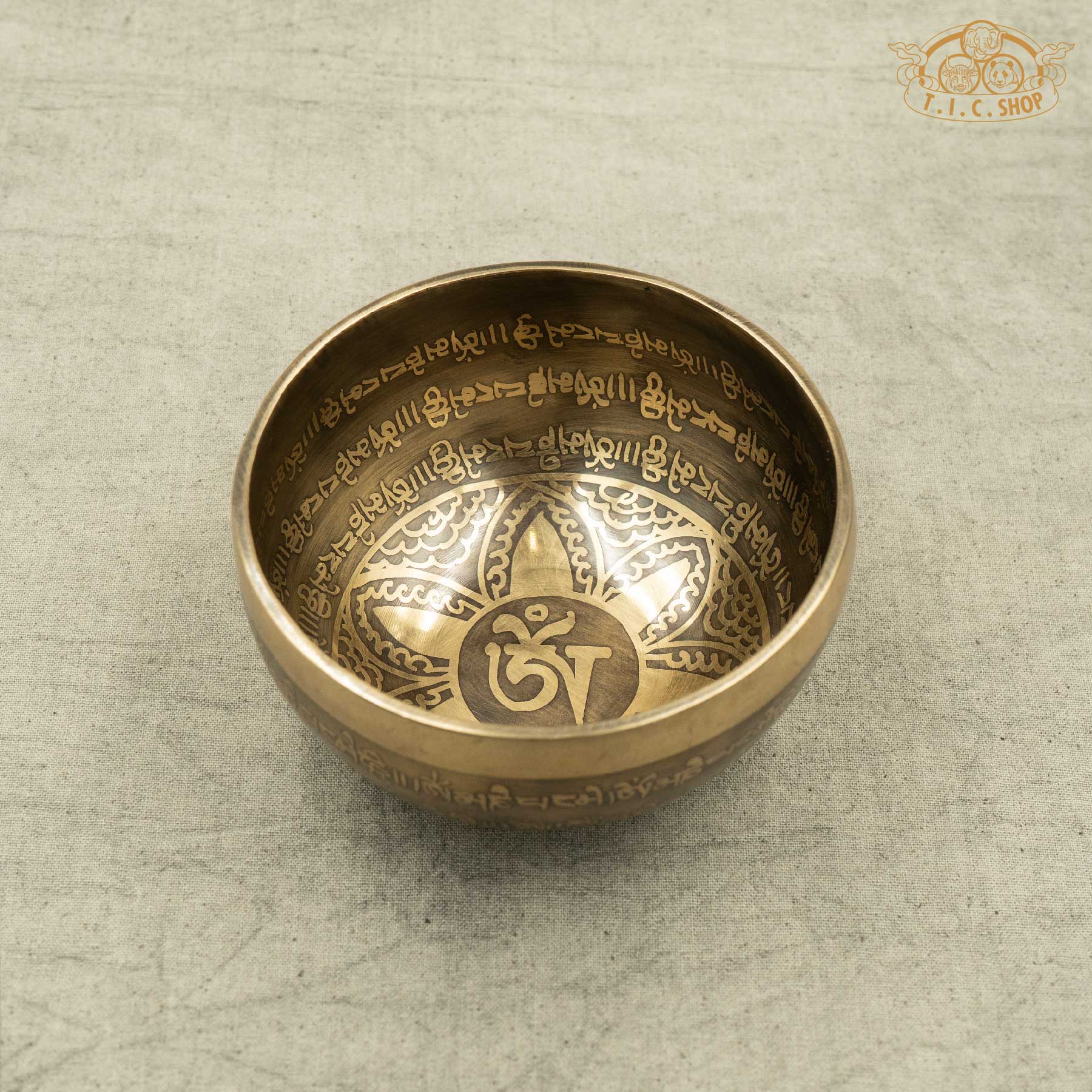 Brass Tibetan singing bowl with engraved OM symbols and Lotus pattern,OM MANI PADME HUM Mantras, handmade by Nepalese artisans for meditation and spiritual practice