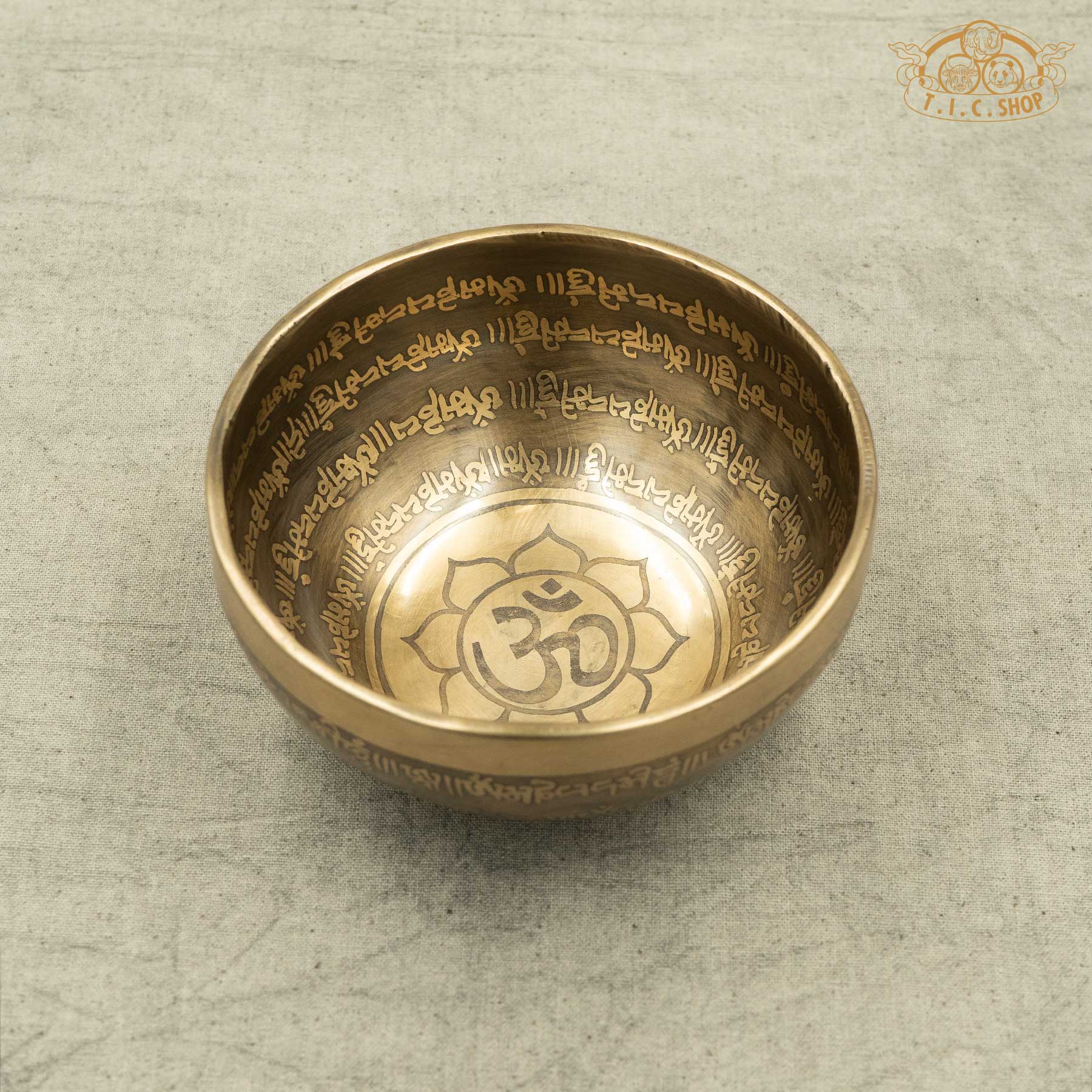 Front view of Tibetan Singing Bowl with Lotus Symbol and OM symble, handmade in Nepal for meditation and spiritual practice