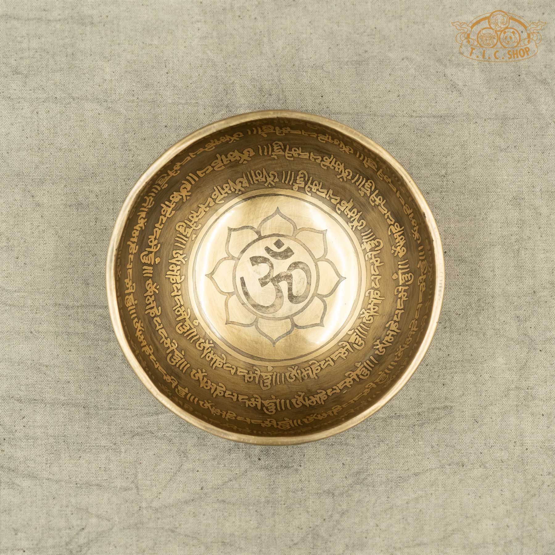 Top view of Tibetan Singing Bowl with Lotus Symbol and OM symble, handmade in Nepal for meditation and spiritual practice