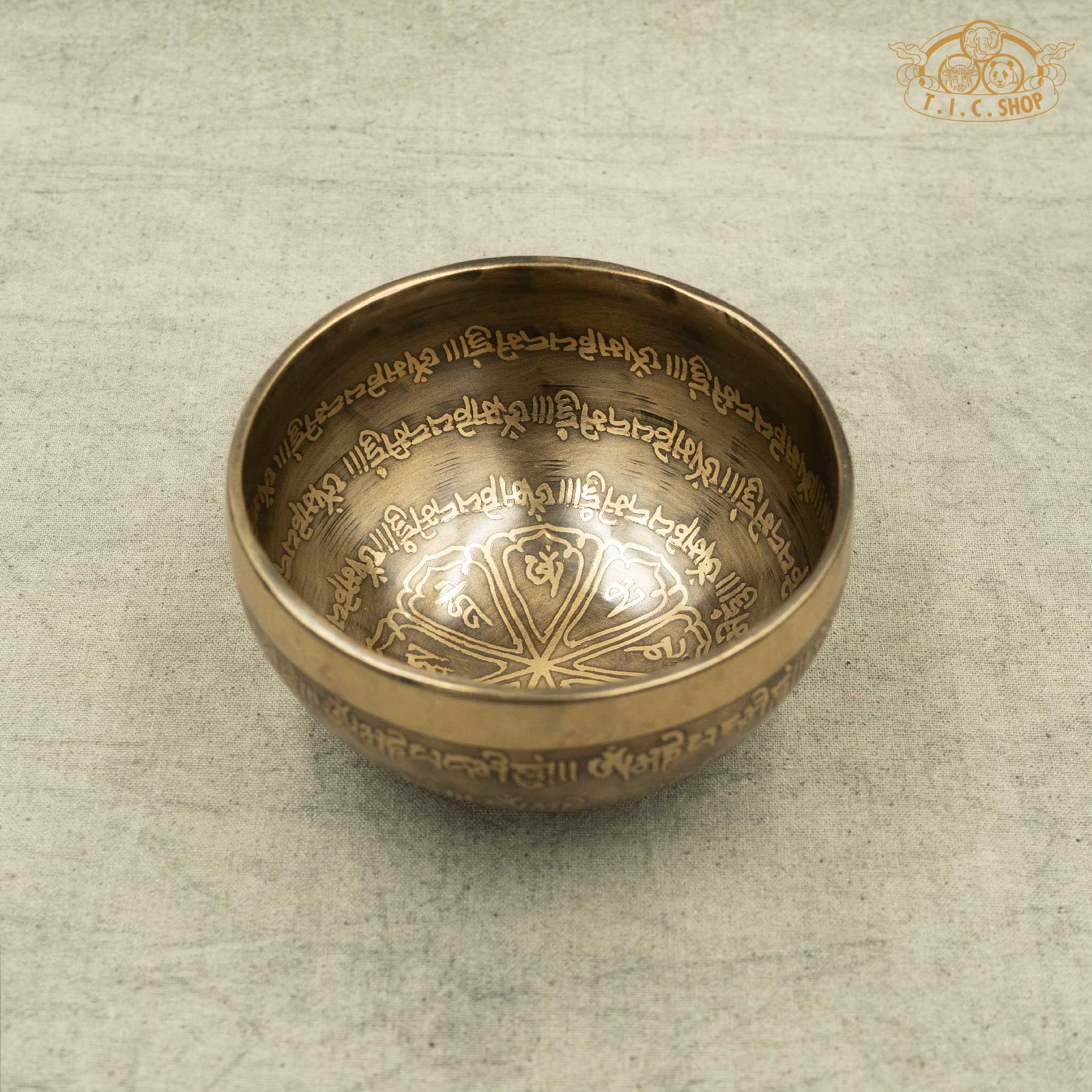 Front view of Tibetan Singing Bowl with lotus symbol and OM MANI PADME HUM Mantras, handmade in Nepal for meditation and spirtual practice