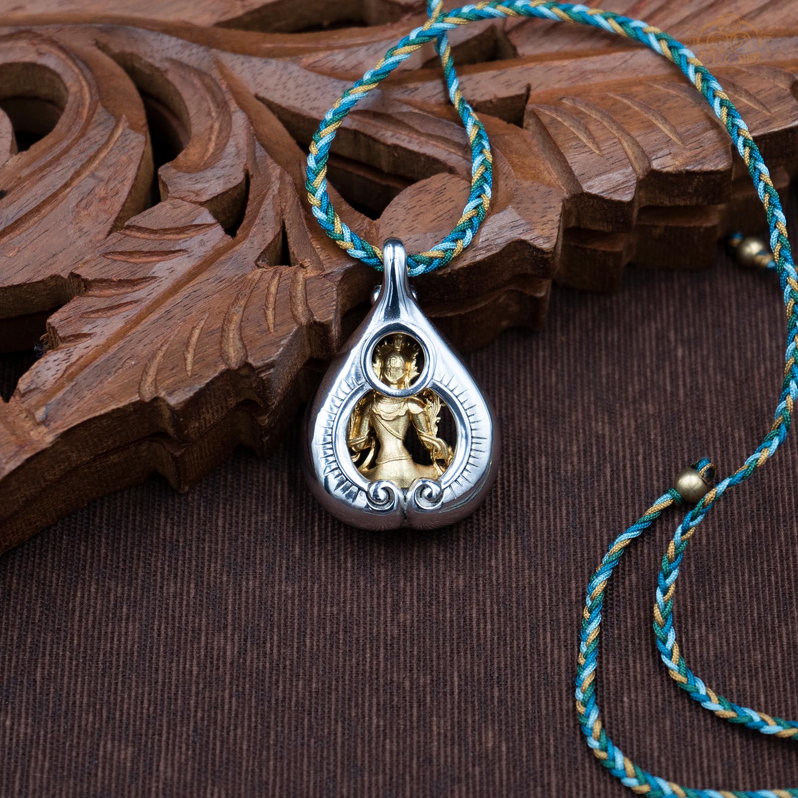 Back view of Green Tara amulet pendant, showing sculpted details and depth