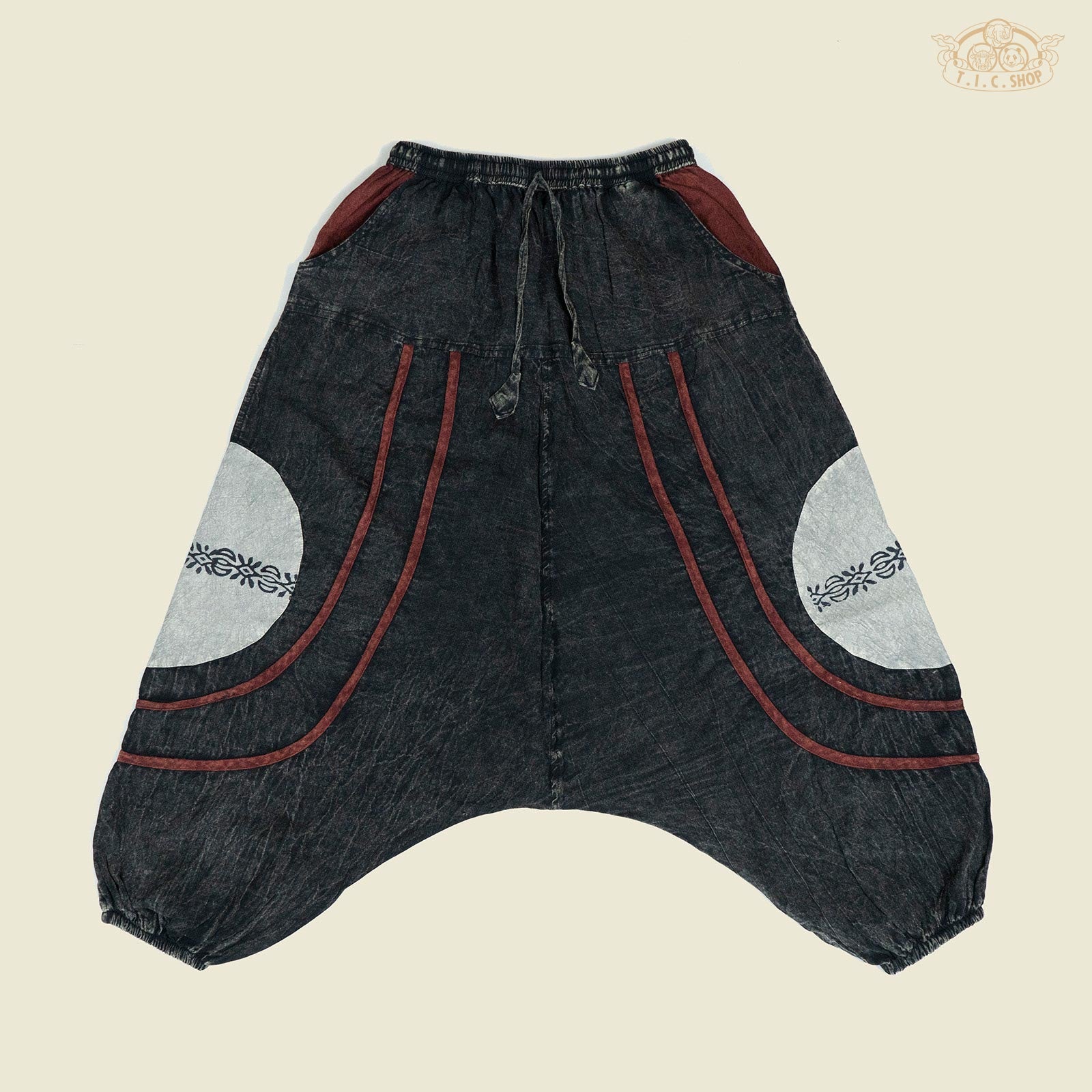 Front view of patterned patchwork harem trousers in relaxed fit with drawstring waist and elastic cuffs.