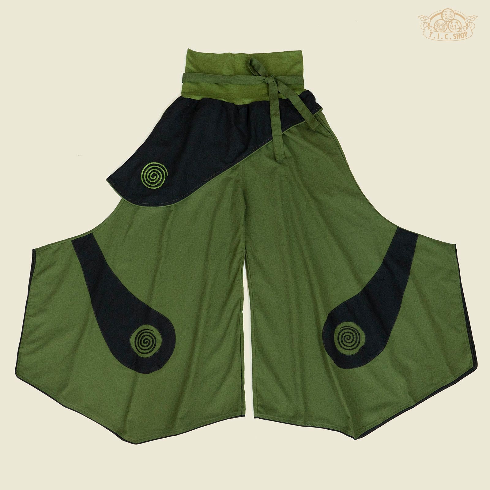 Front view of spiral embroidery loose-fit cotton trousers with elastic waistband and belt.