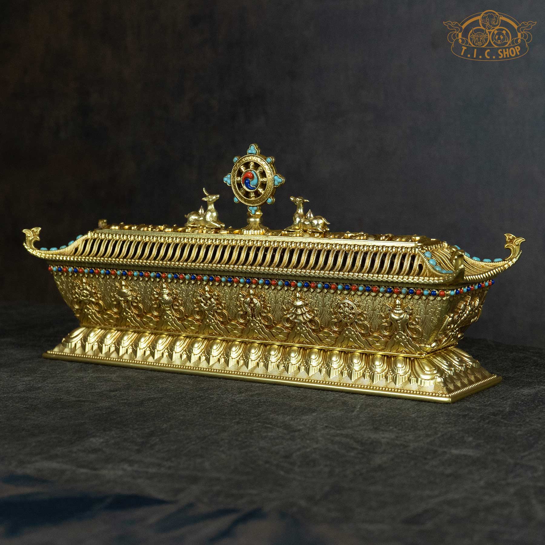 Side view of brass pagoda incense burner showing intricate openwork lid and temple-style eaves.
