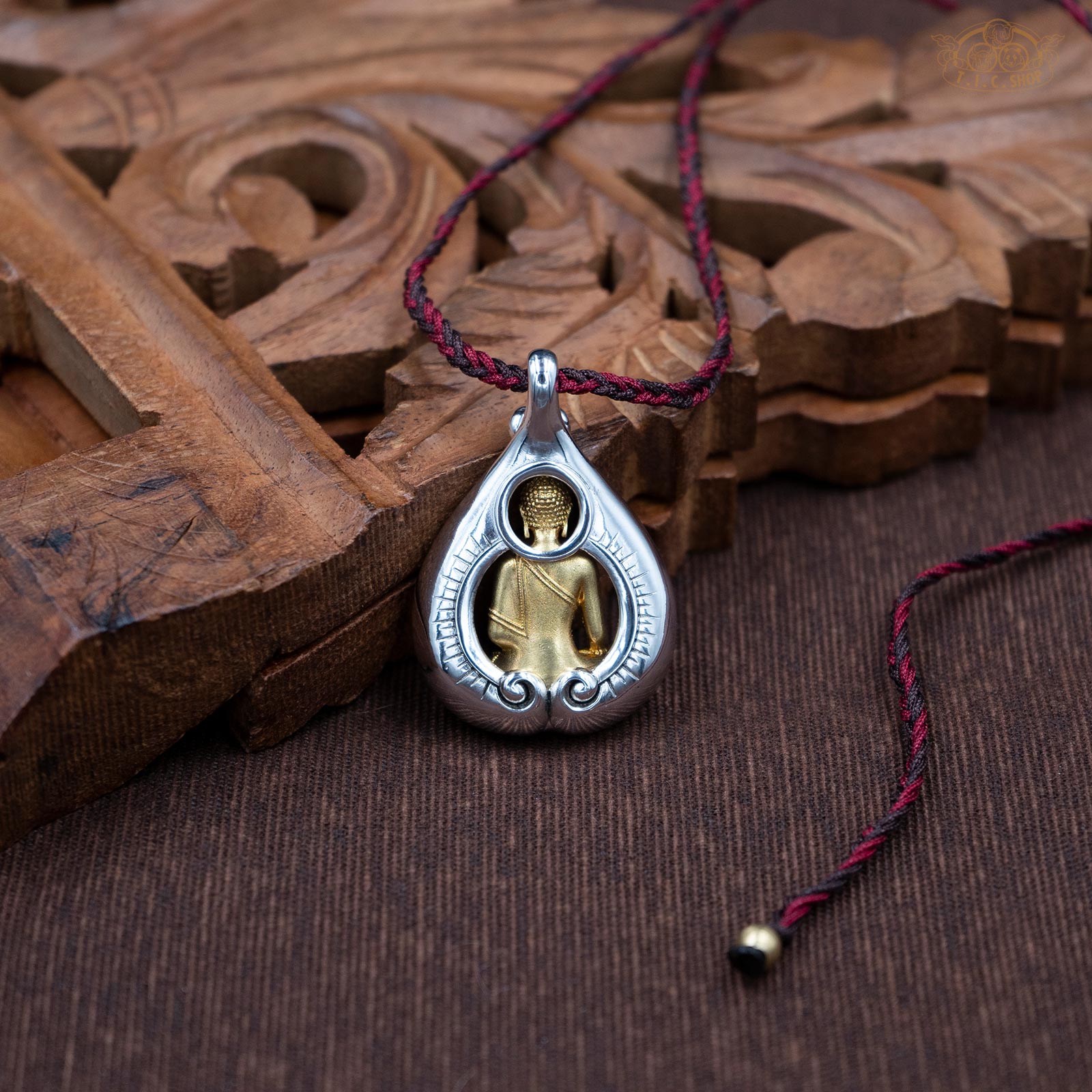 Back view of Shakyamuni Buddha amulet pendant, showing sculpted details and depth