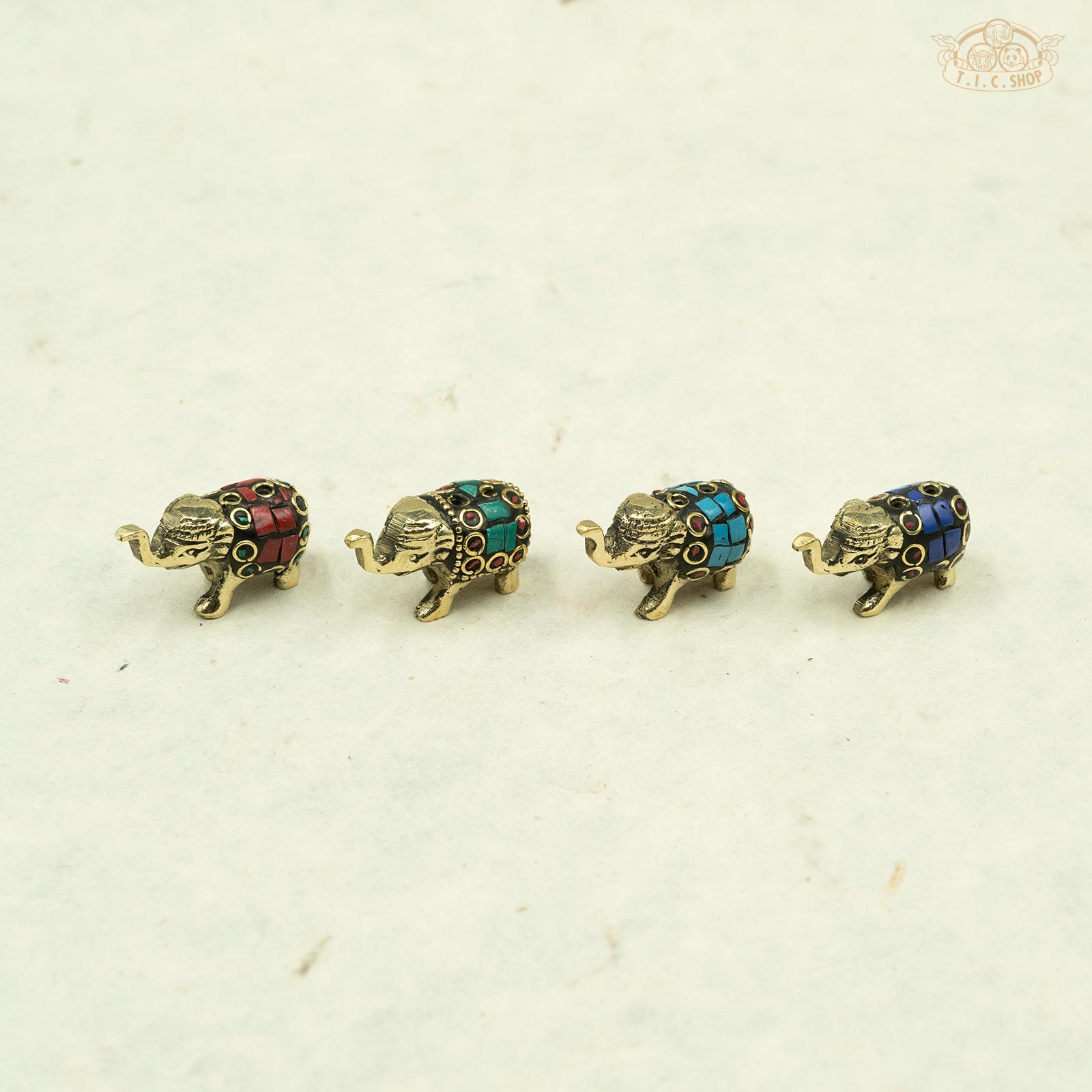 Front view of mini brass elephant incense holder, handcrafted for Indian incense sticks.