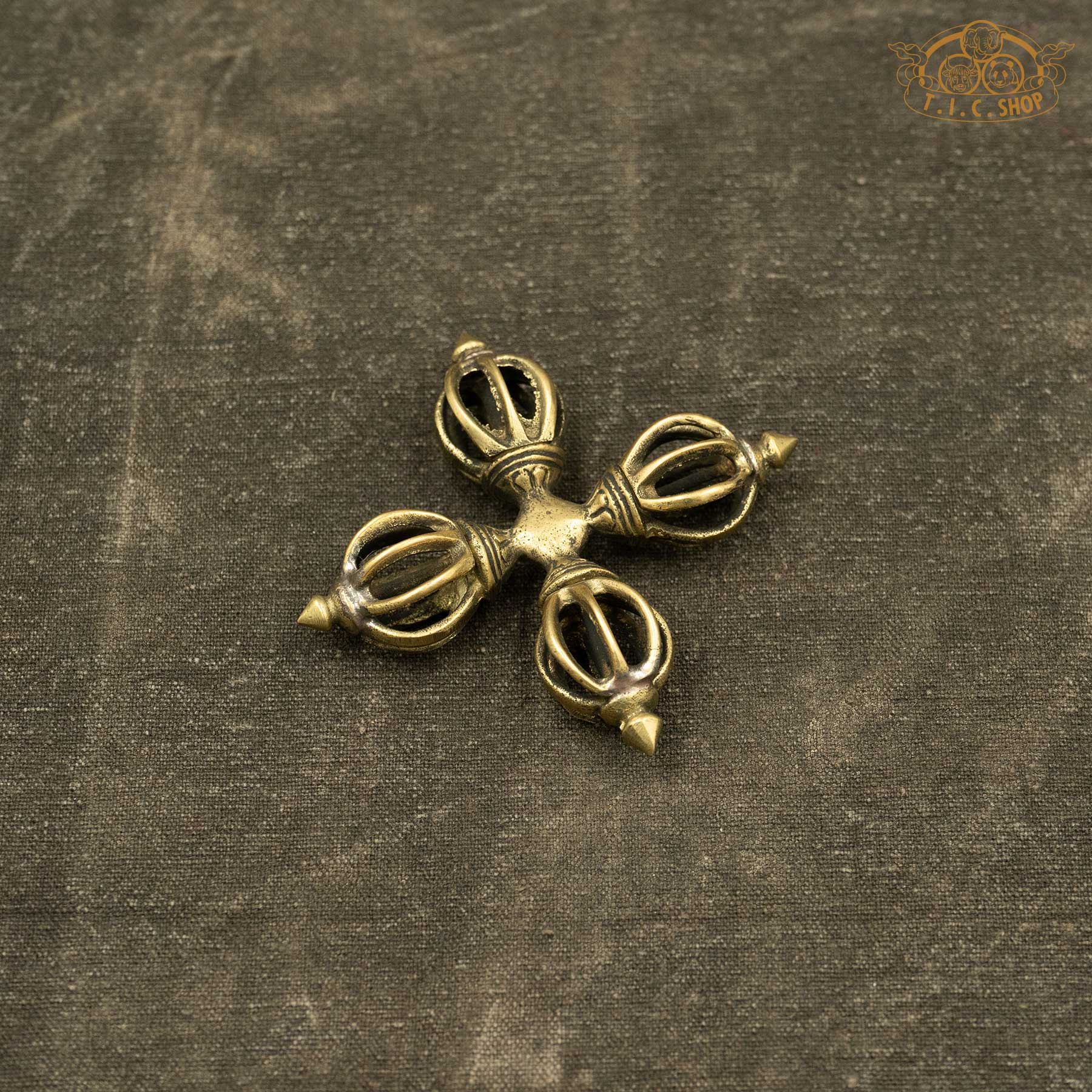 Top view of Tibetan ritual brass Double Vajra used in Buddhist ceremonies and altar offerings