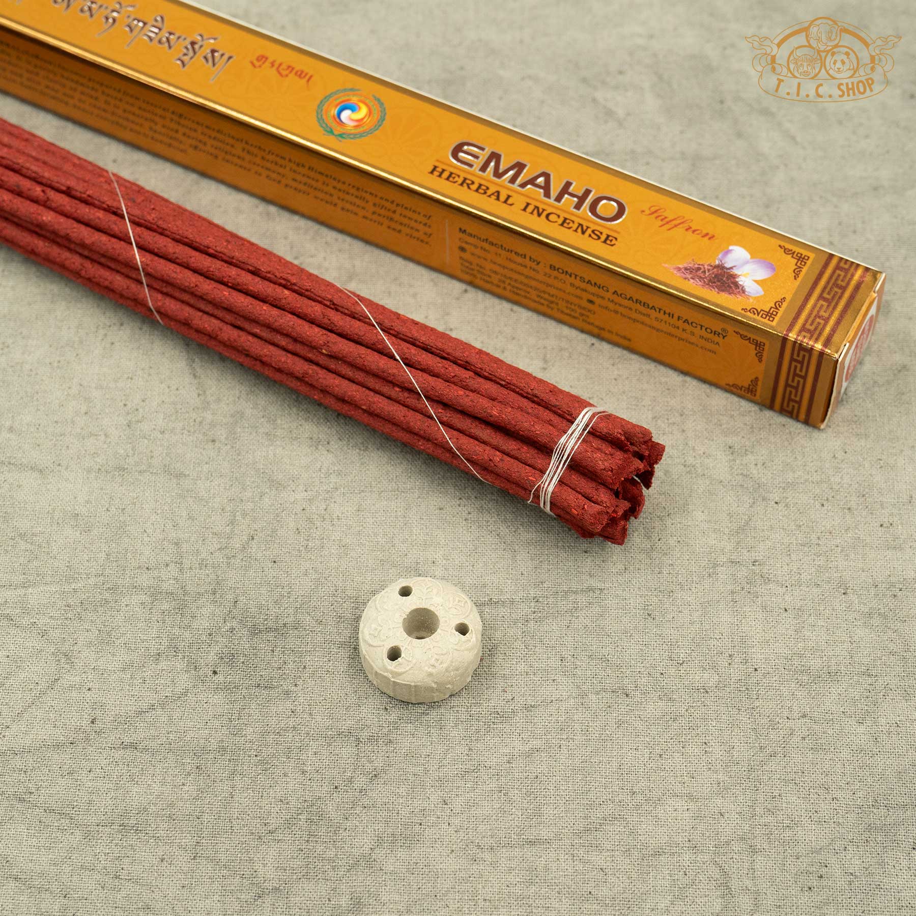 A pack of Emaho Saffron handmade Incense sticks with small handmade incense holder