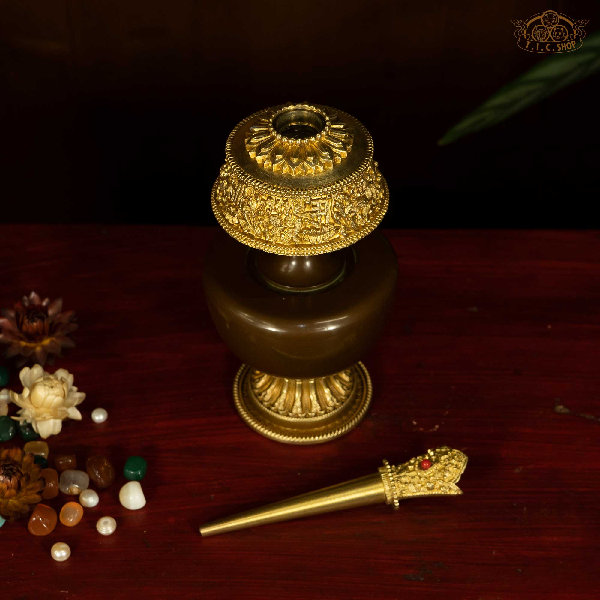 Top view of Tibetan brass Bumpa ritual vase showing decorative lid and finial