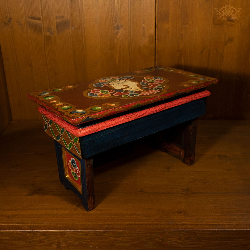 Back view of wooden Tibetan Buddhist prayer table showing sturdy foldable frame