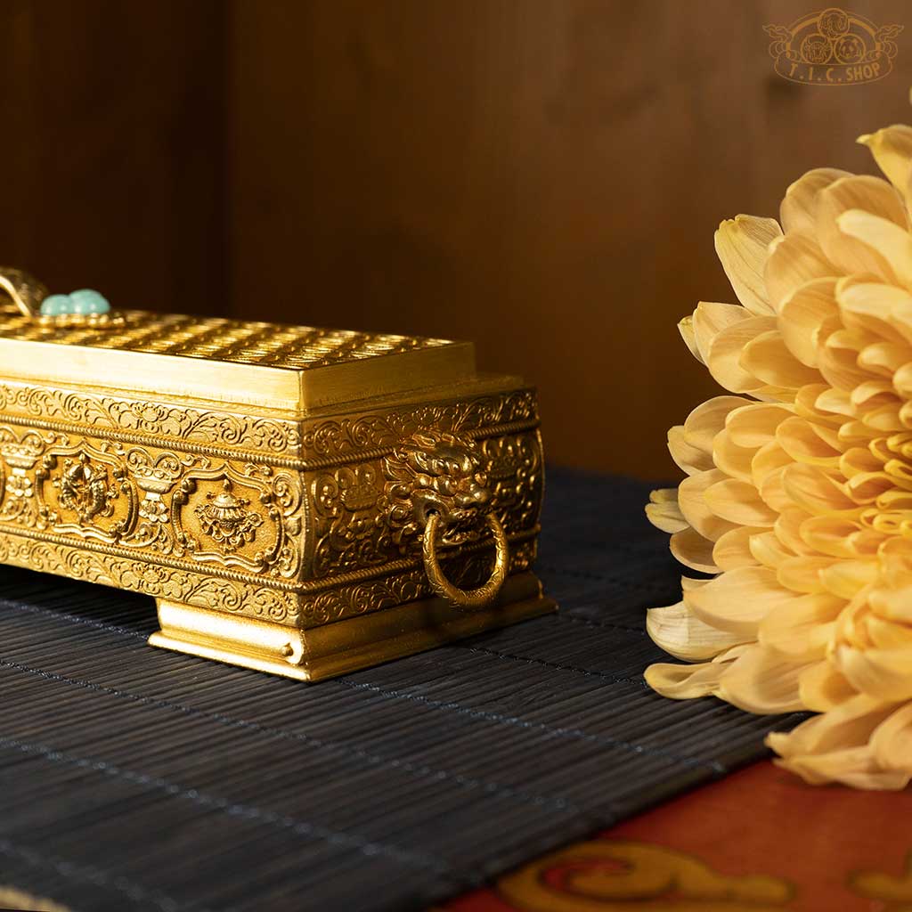 Close-up detail of the intricate three-dimensional carvings on the incense burner’s lid and body.