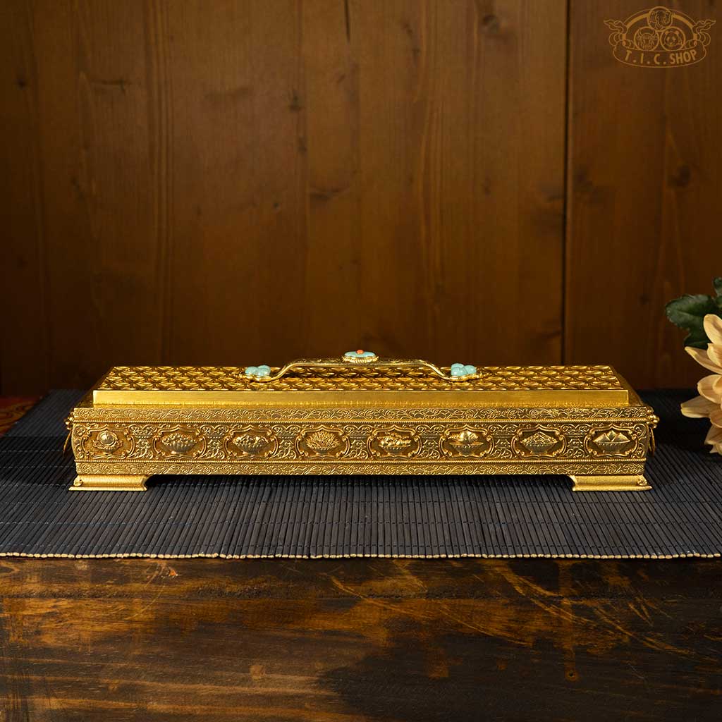 Back view of incense burner displaying the Eight Auspicious Objects in detailed relief.
