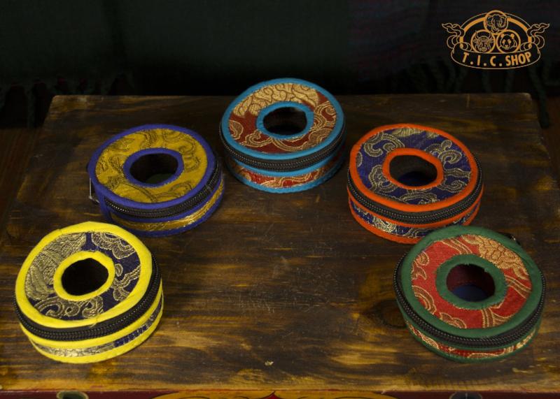 Top view showing the opening of the Tingsha bell case, highlighting fabric and protective interior.