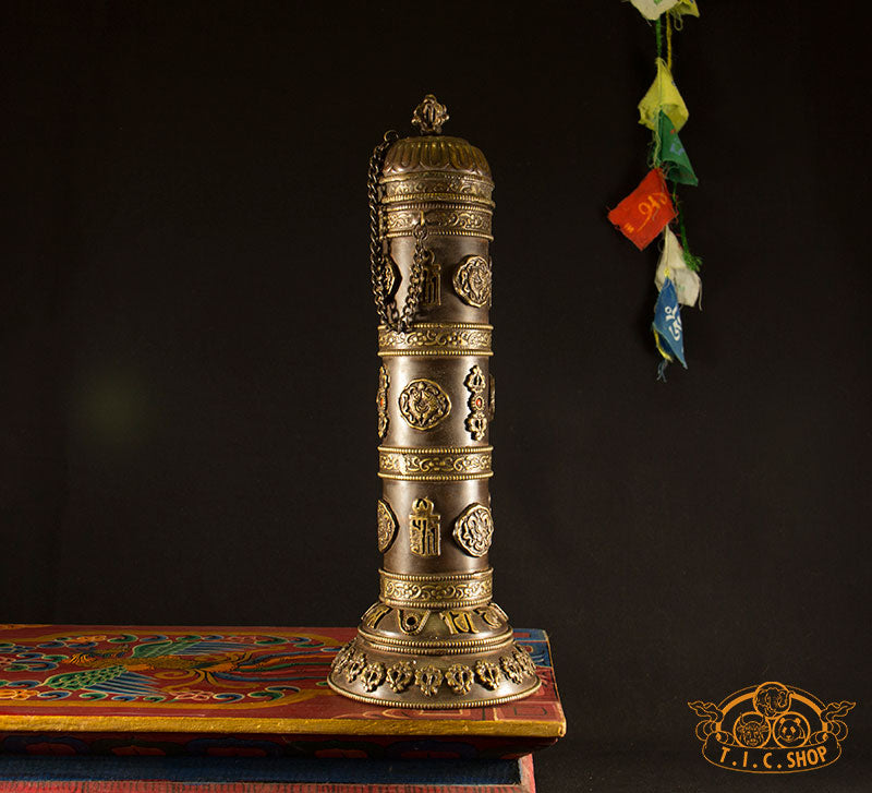 Front view of tall Tibetan copper incense burner with antique finish and engraved 8 Auspicious Symbols, Kalachakra, and Vajra motifs.