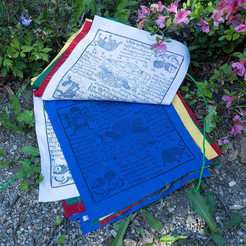 Detailed view of Tibetan Windhorse prayer flags showcasing vibrant traditional designs on cotton fabric