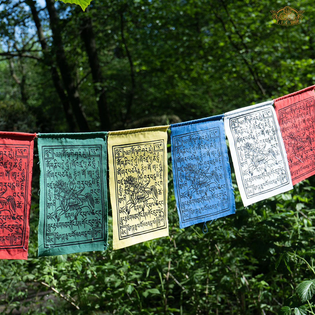 Close-up of colorful Tibetan Windhorse prayer flags handcrafted on cotton fabric with traditional symbols