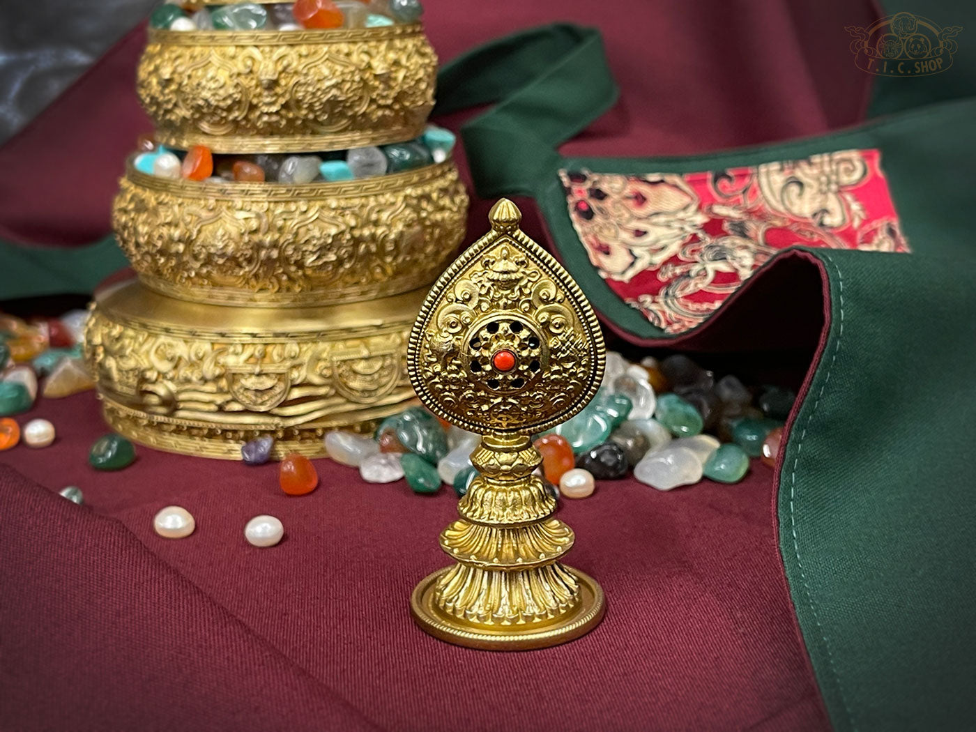 Tibetan golden mandala offering set with gemstone offerings and ornate metal top charm