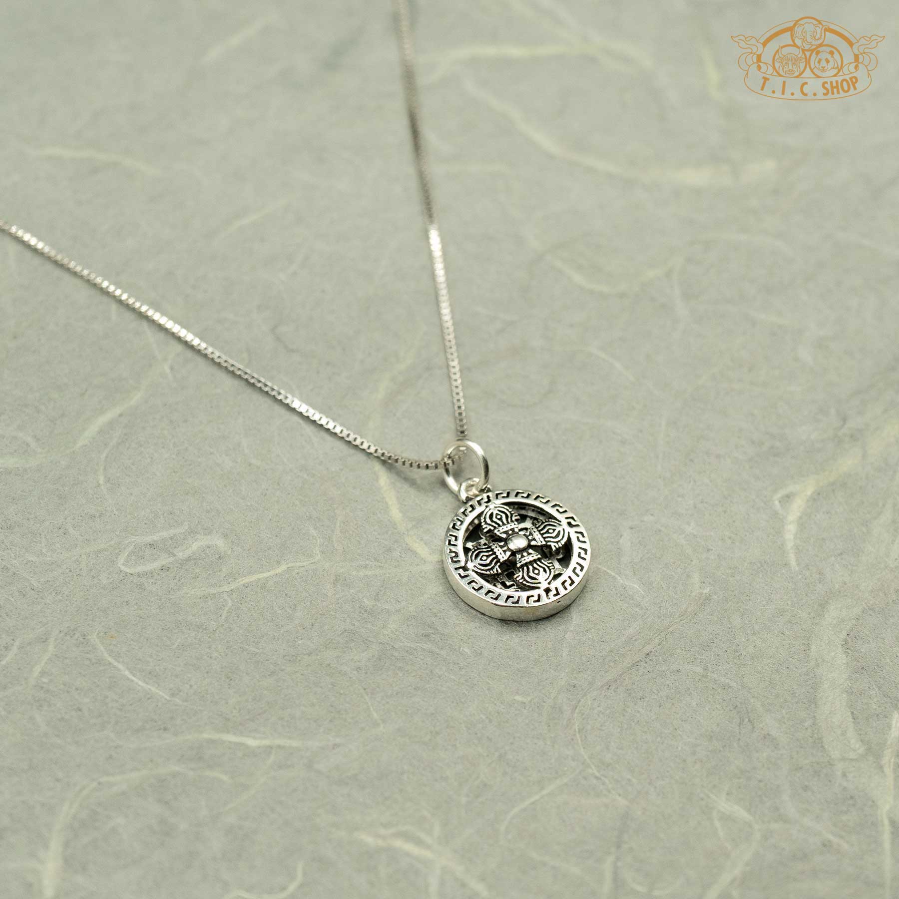 Side profile of the 925 silver pendant highlighting the three-dimensional relief and sturdy silver mounting ring.