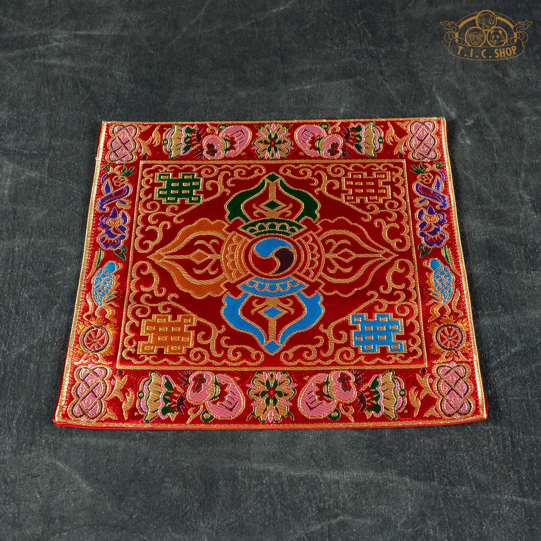 Top view of the 22x22 cm Double Vajra table mat(Red) highlighting the symmetrical pattern and rich ornamental borders.