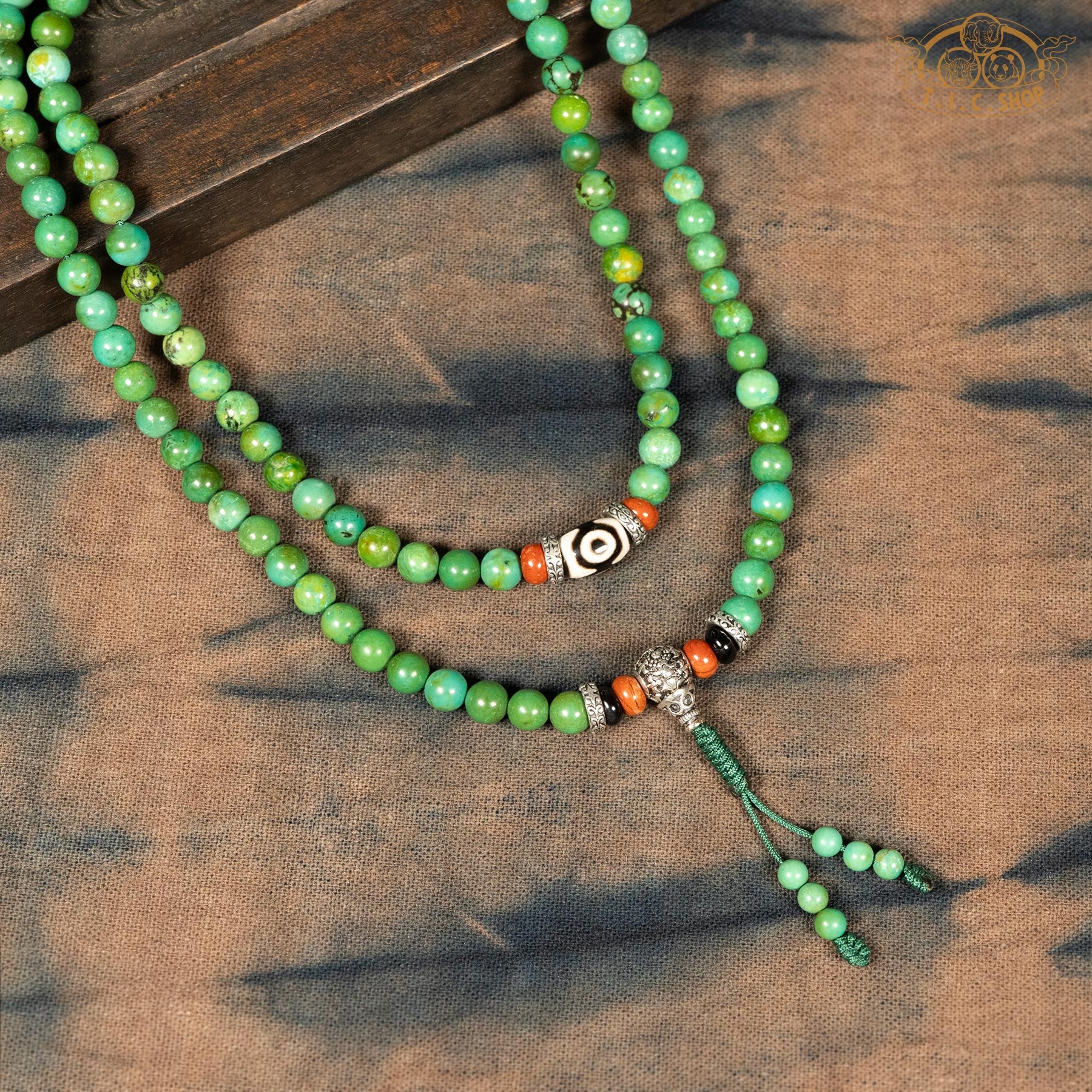 Detail of enhanced turquoise stone 6mm 108-bead traditional prayer mala