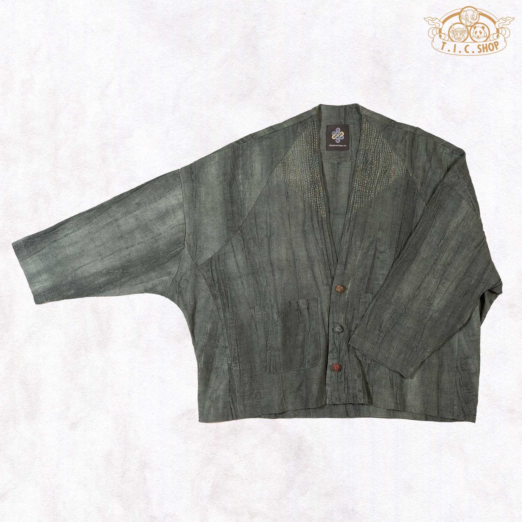 Side view showcasing the wide, flowing batwing sleeves and the natural drape of the artisan linen material.