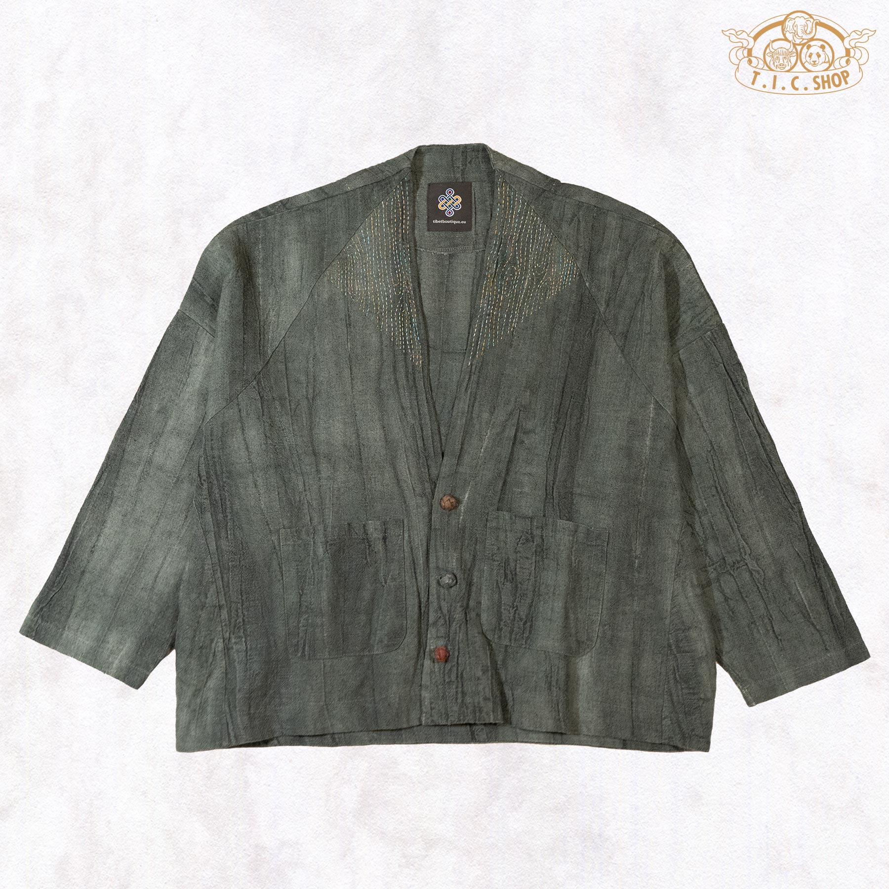 Front view of a forest green hand-dyed linen Zen cardigan with wide batwing sleeves and a relaxed open-front design.
