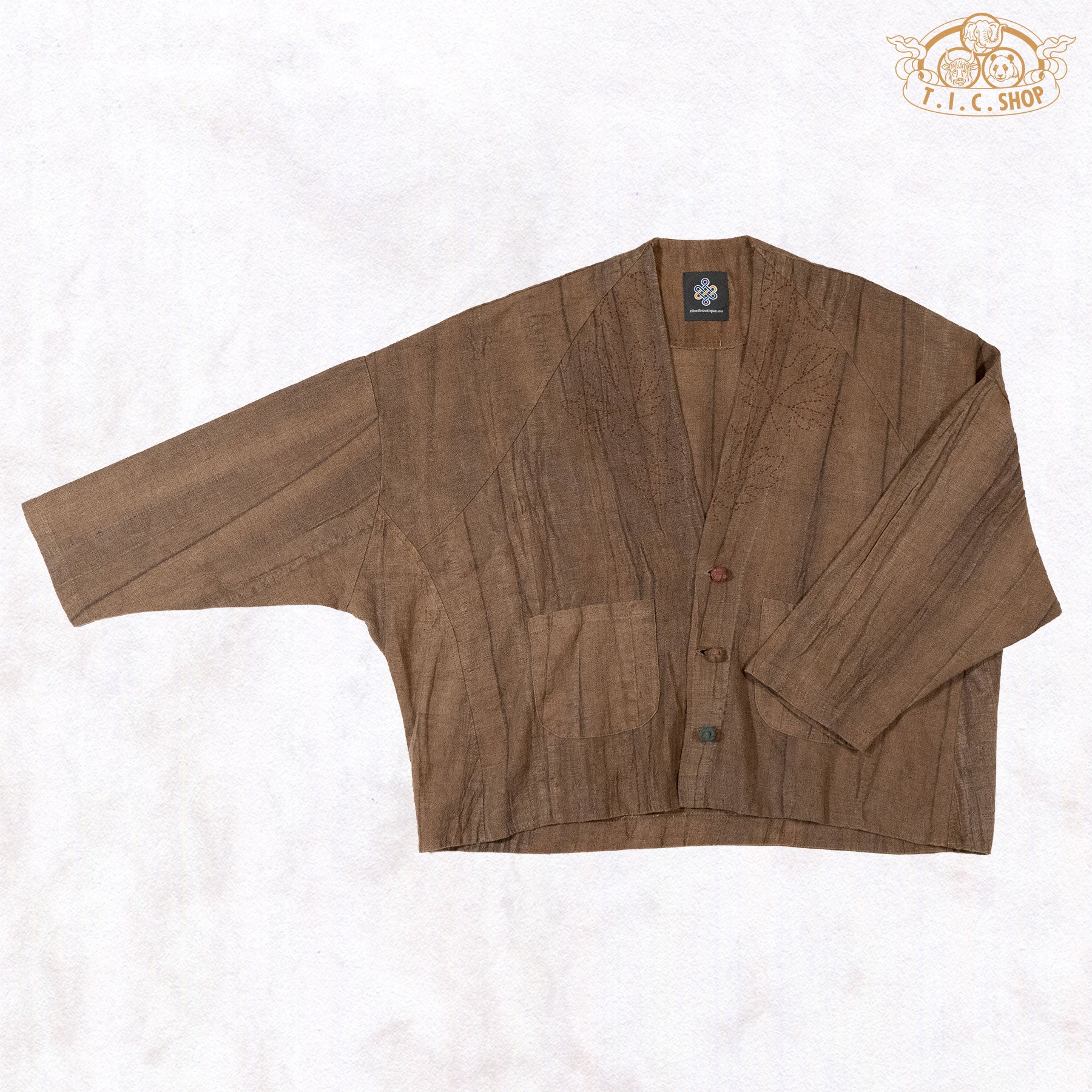 A display of the wide, draped batwing sleeves highlighting the relaxed silhouette and breathable fabric texture