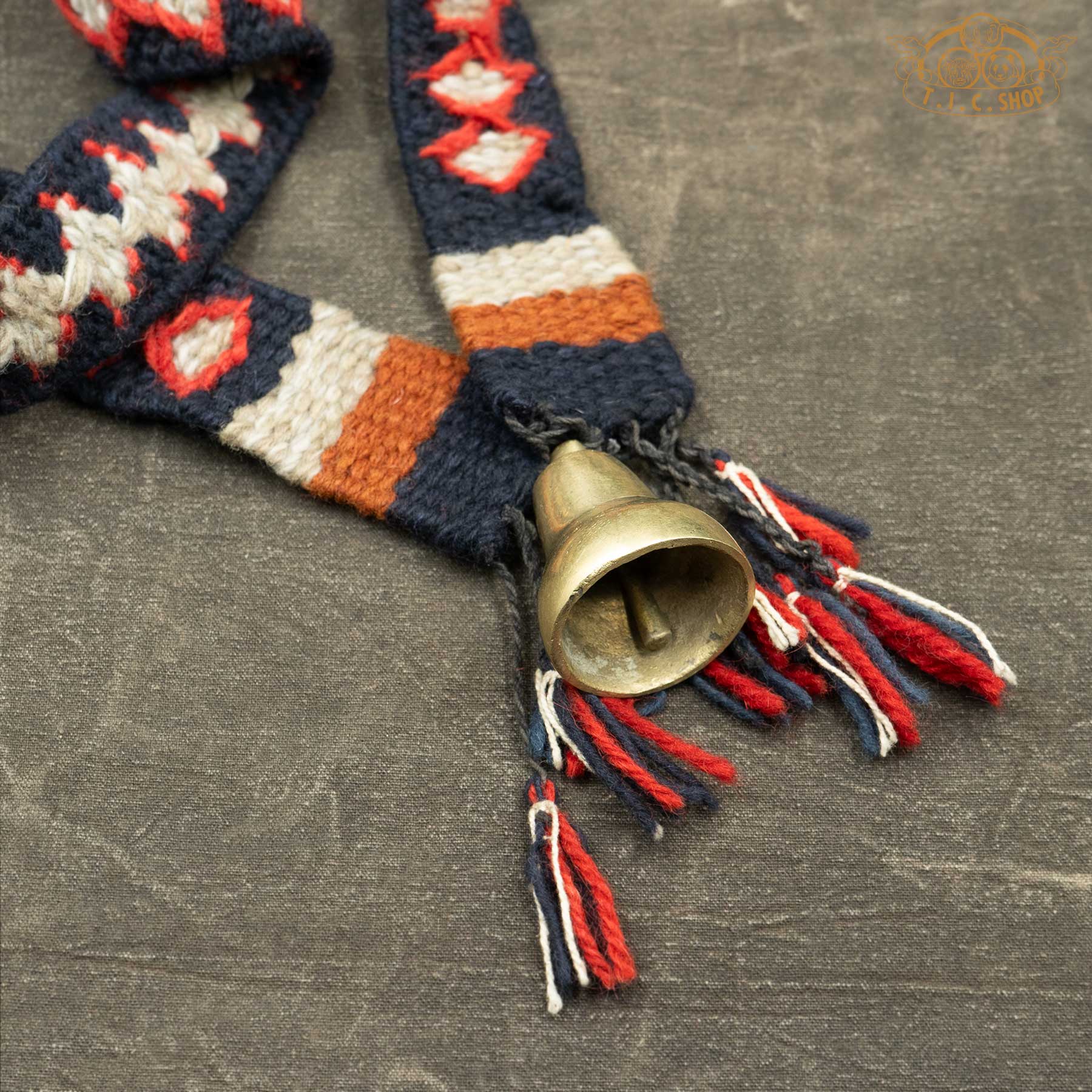 Details of Handmade Himalayan Antique Bronze Yak Bell Small with handwoven blue and red strap