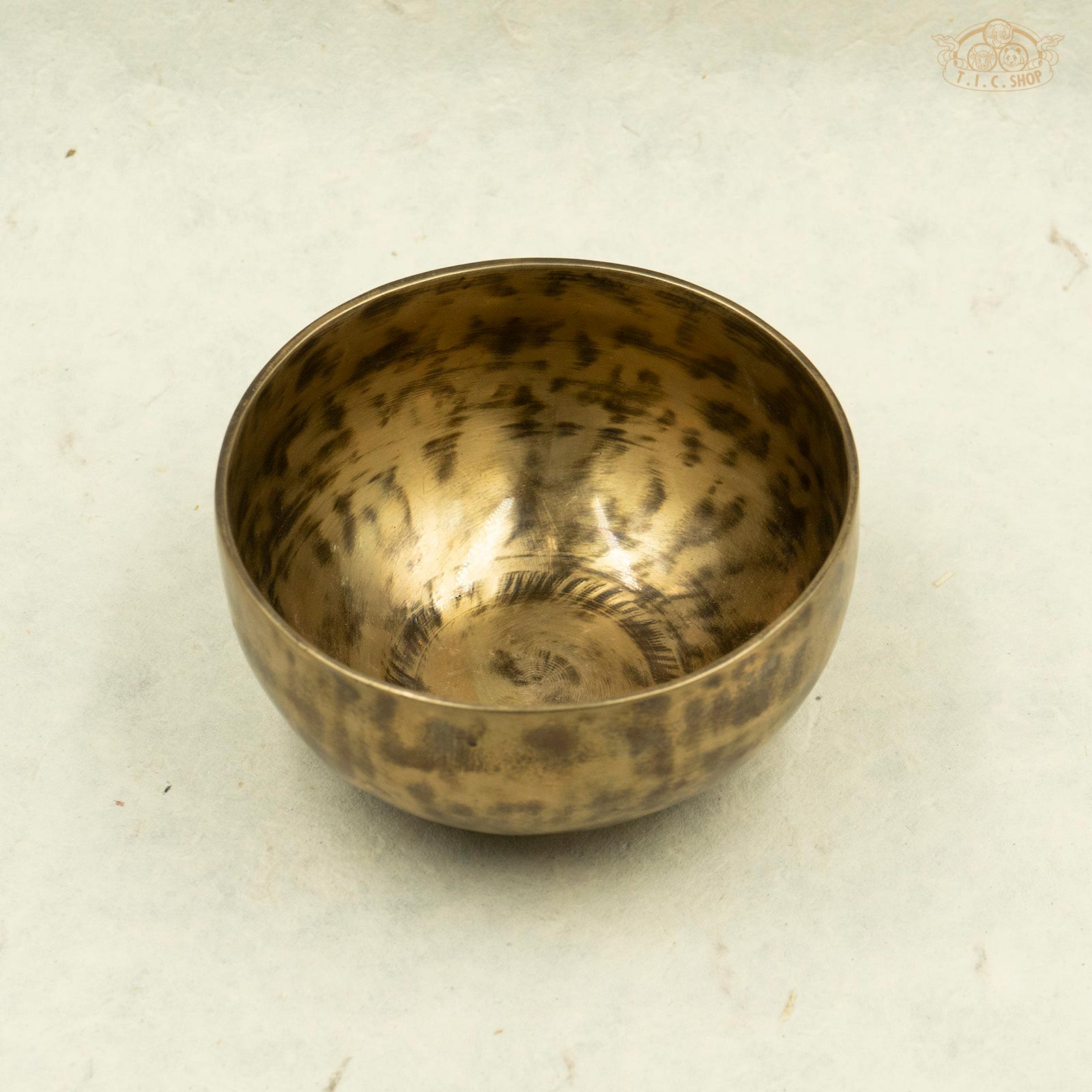 Front view of Tibetan antique singing bowl made of brass, handcrafted in Nepal, for meditation and spiritual practice.