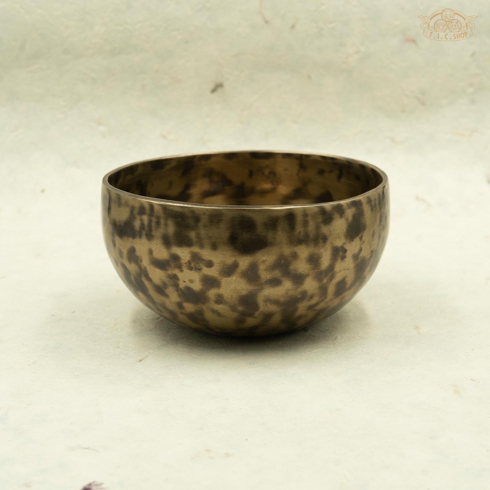 Side view of antique singing bowl made of brass, handcrafted in Nepal, for meditation