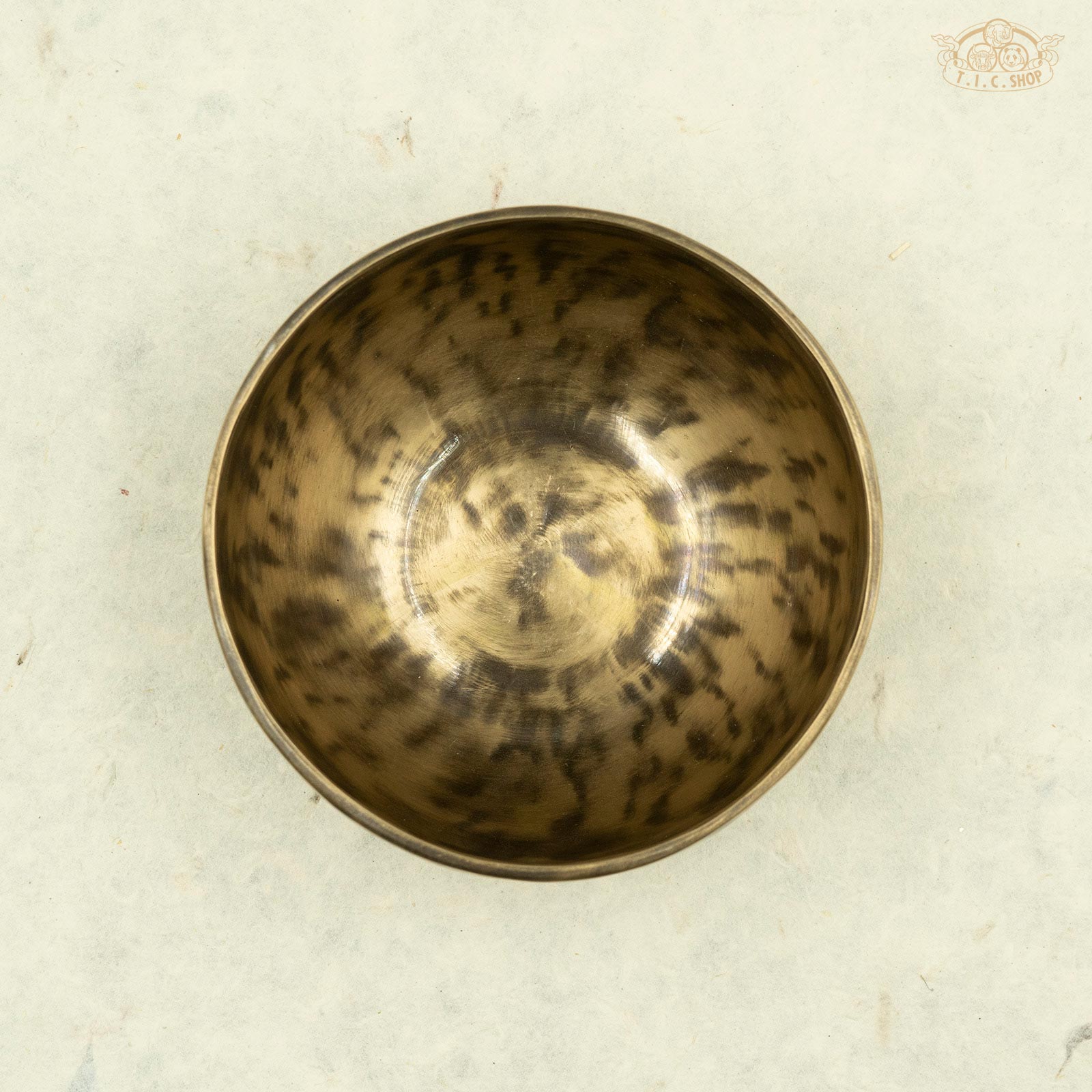 Top view of a antique singing bowl made of brass, handcrafted in Nepal, for meditation