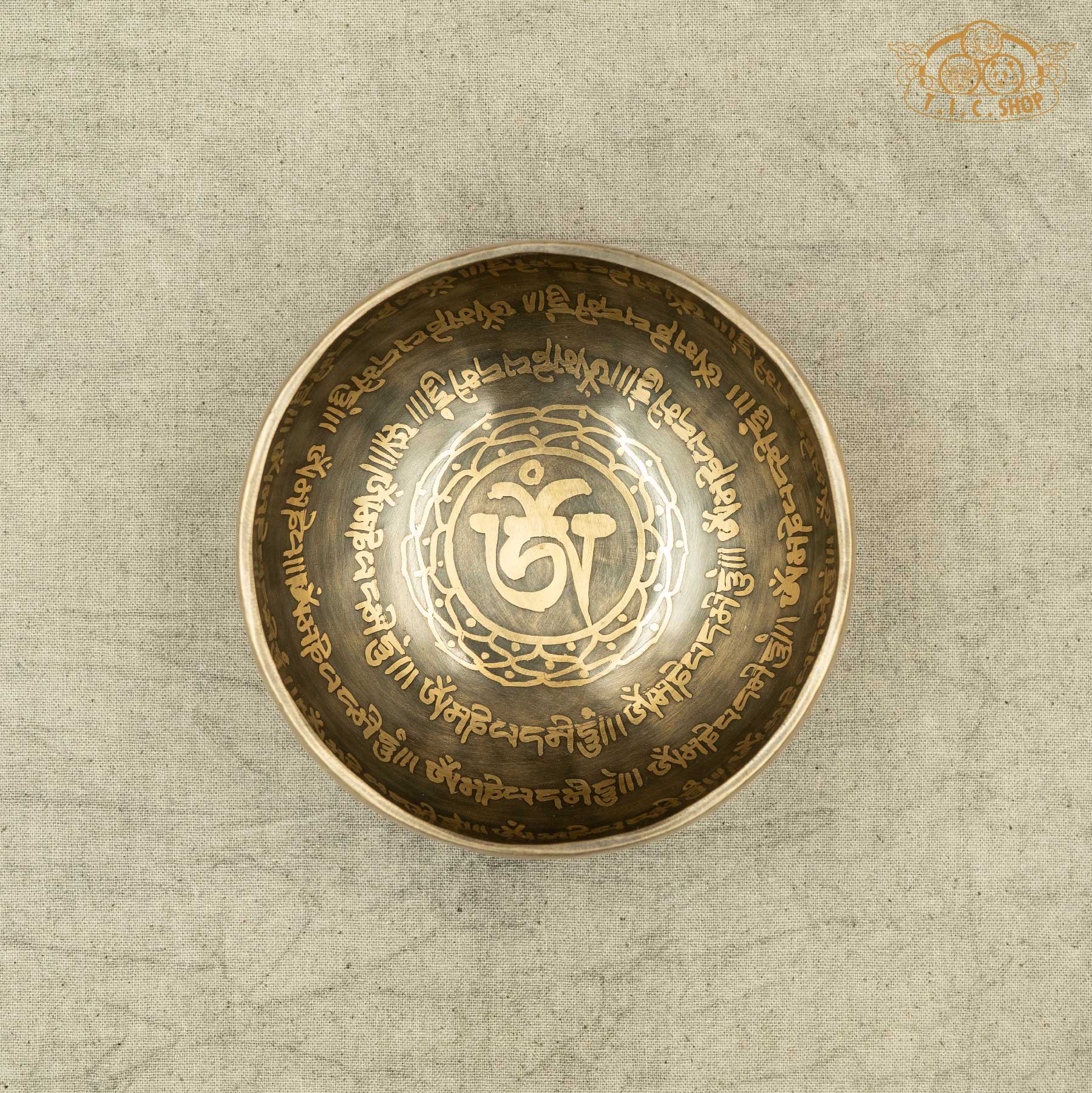 Top view of Tibetan Singing Bowl with OM Symbol and OM MANI PADME HUM Mantras, handmade in Nepal for meditation and spiritual 