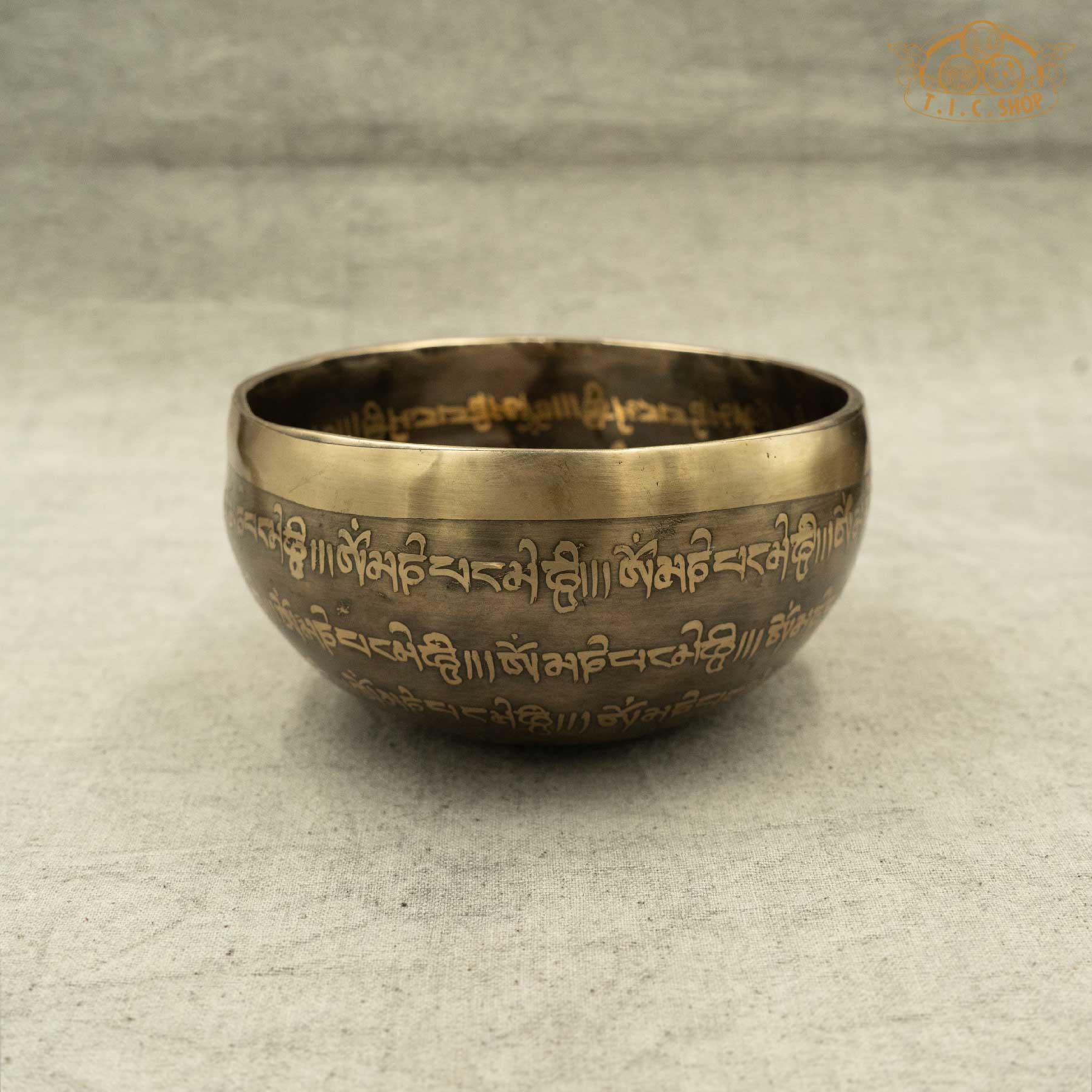 Brass Tibetan singing bowl with engraved designs and OM MANI PADME HUM Mantras,handmade by Nepalese artisans for meditation _side view