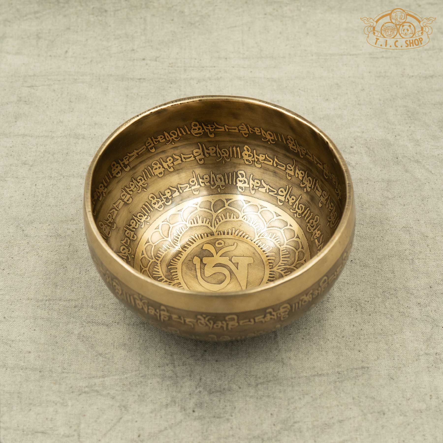 Front view of Om Tibetan singing bowl with engraved mantra, handmade in Nepal for meditation and spiritual practice