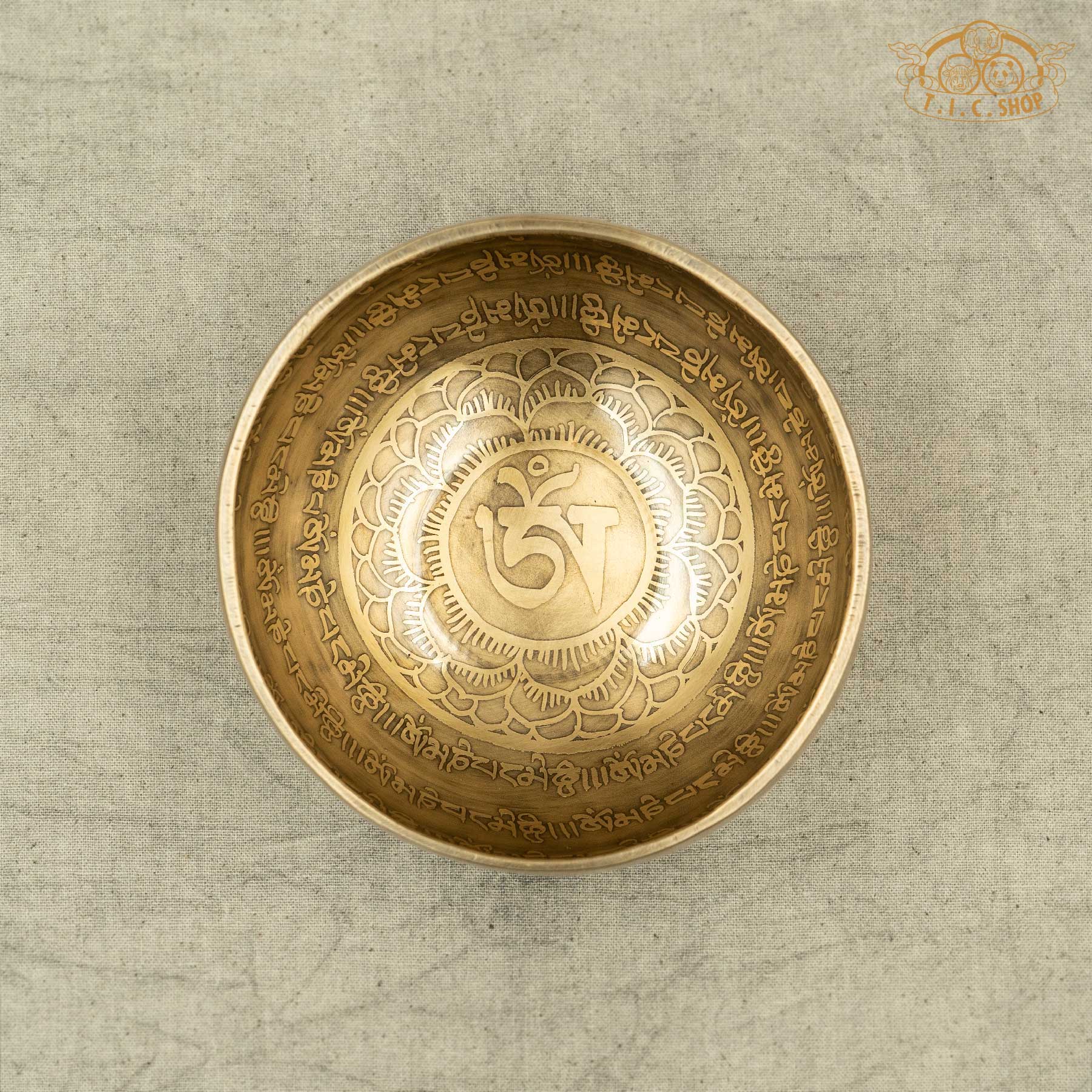 Top view of Om Tibetan singing bowl showing intricate mantra engraving, handcrafted in Nepal for altar and mindfulness