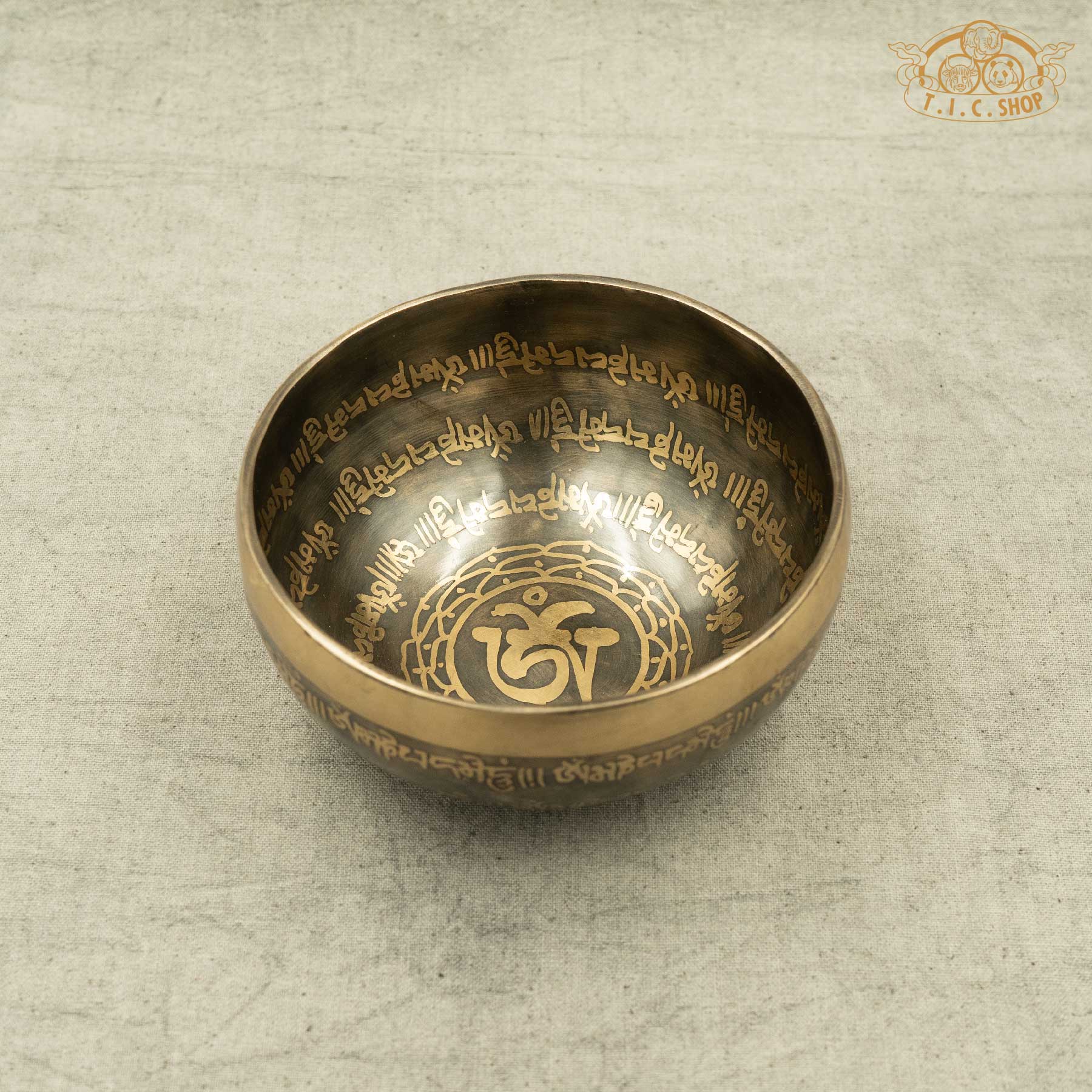 Front view of Tibetan Singing Bowl with OM Symbol and OM MANI PADME HUM Mantras, handmade in Nepal for meditation and spiritual practice