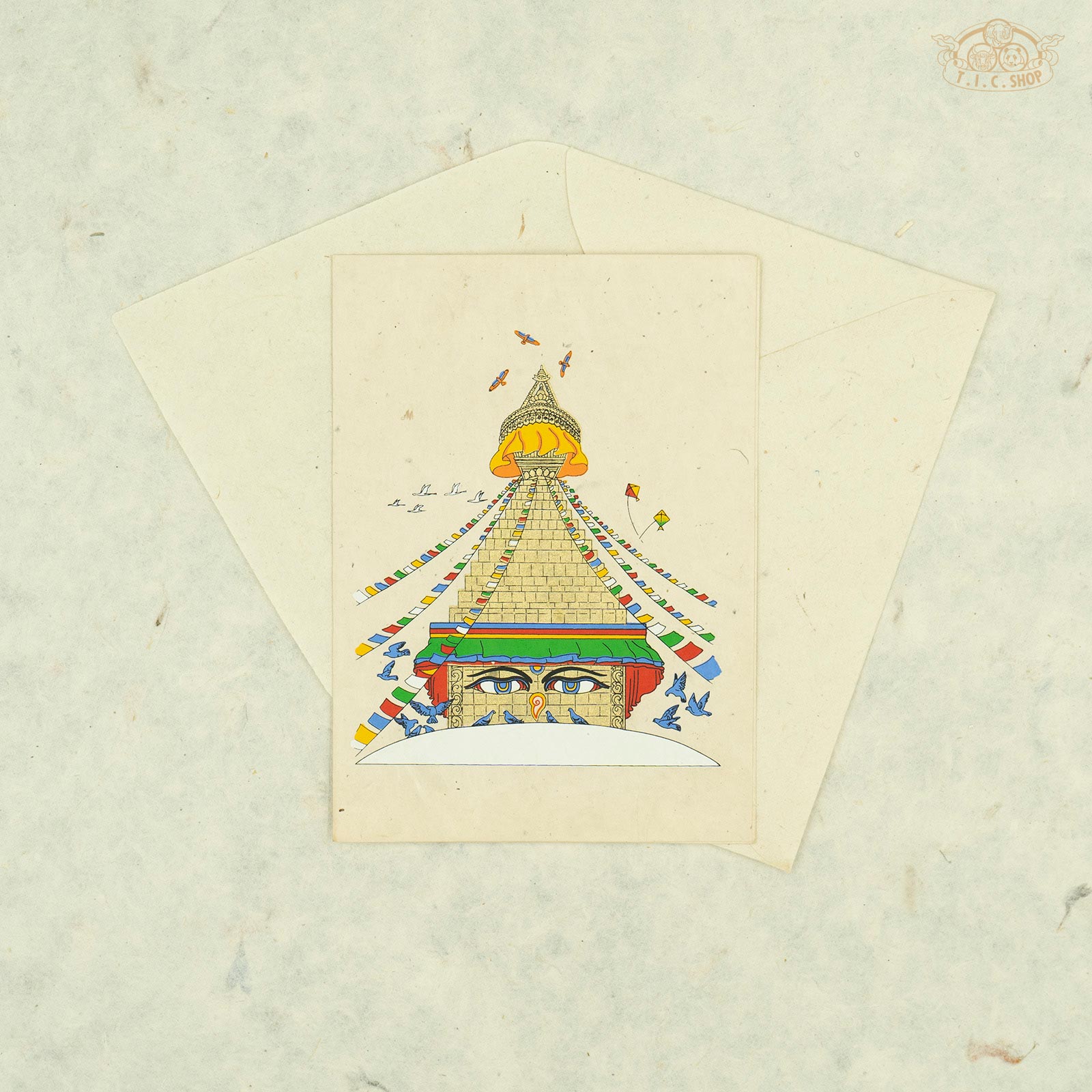 Handmade Nepalese Lokta paper greeting card featuring a traditional Buddhist stupa design symbolizing enlightenment