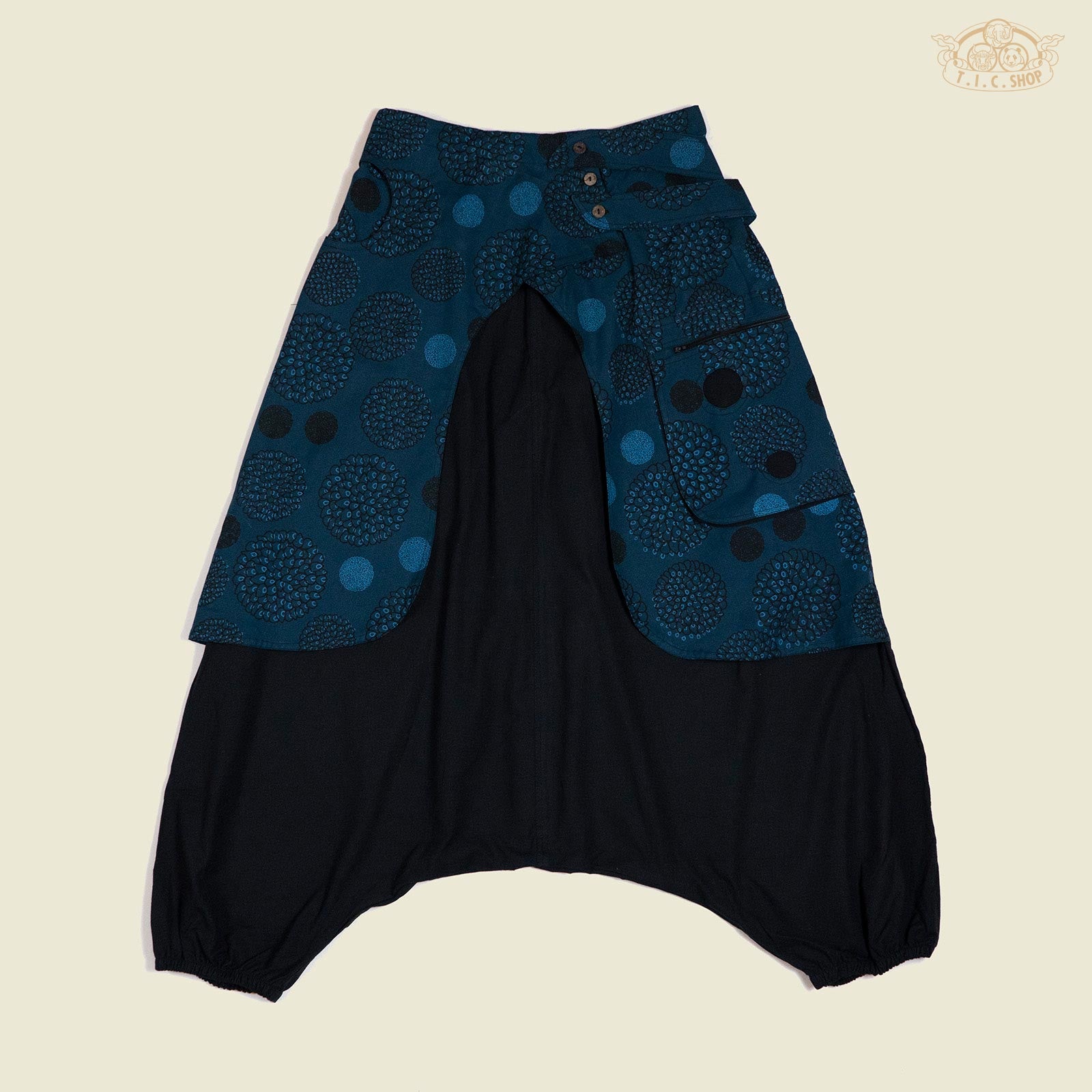 Front view of floral print loose-fit trousers with elastic waistband and patch pocket with zipper.